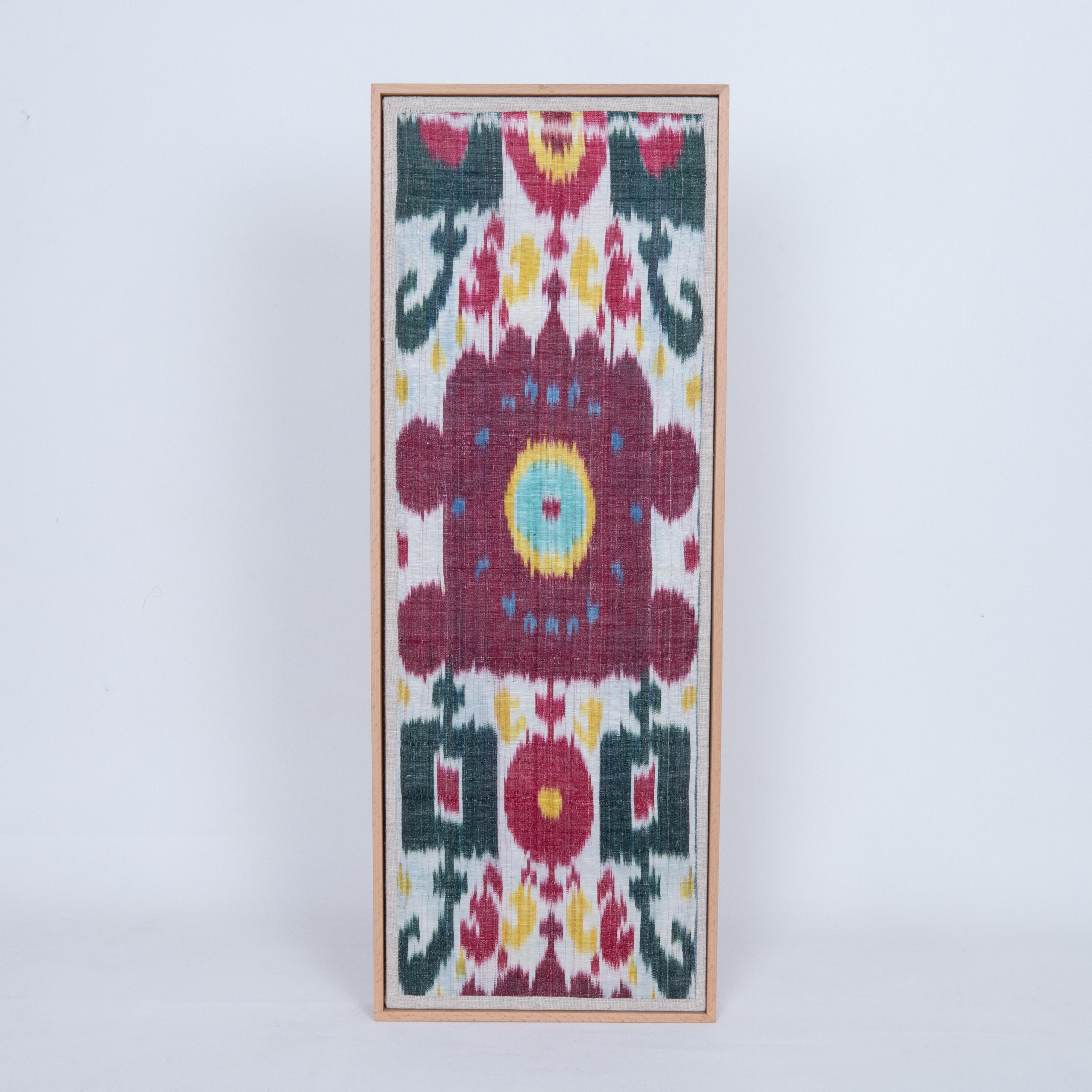 First the fragment has been hand backed on a linen fabric, then stretched over a wooden stretcher and finished with a wooden frame.
Late 19th C. Uzbekistan
Ready to go on a wall.
