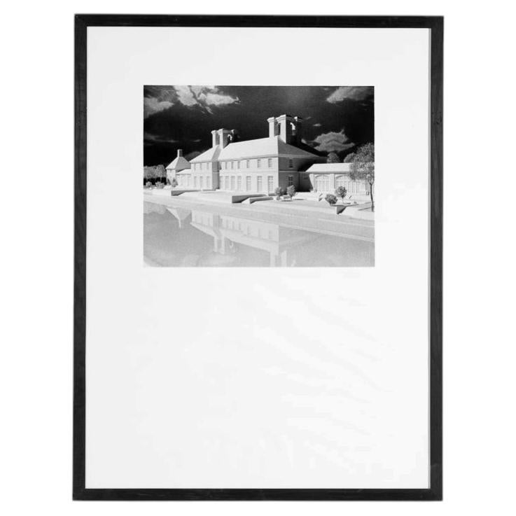 Gerahmtes Schwarz-Weiß-Foto eines Musterhauses