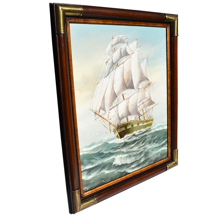 Large, oil on canvas nautical maritime painting of a ship at sea signed by artist M. Grant. This piece is a tall vertical portrait style in shape and is framed in a wooden frame with brass mounts at corners and burl wood detail on the inside. Brass