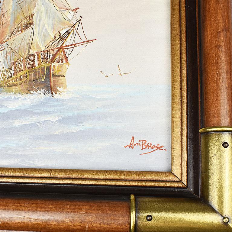 Large, oil on canvas nautical maritime painting of a ship at sea signed by artist Ambrose. This piece is a tall vertical portrait style in shape and is framed in a wooden frame with brass mounts at the corners and burl wood detail on the inside.