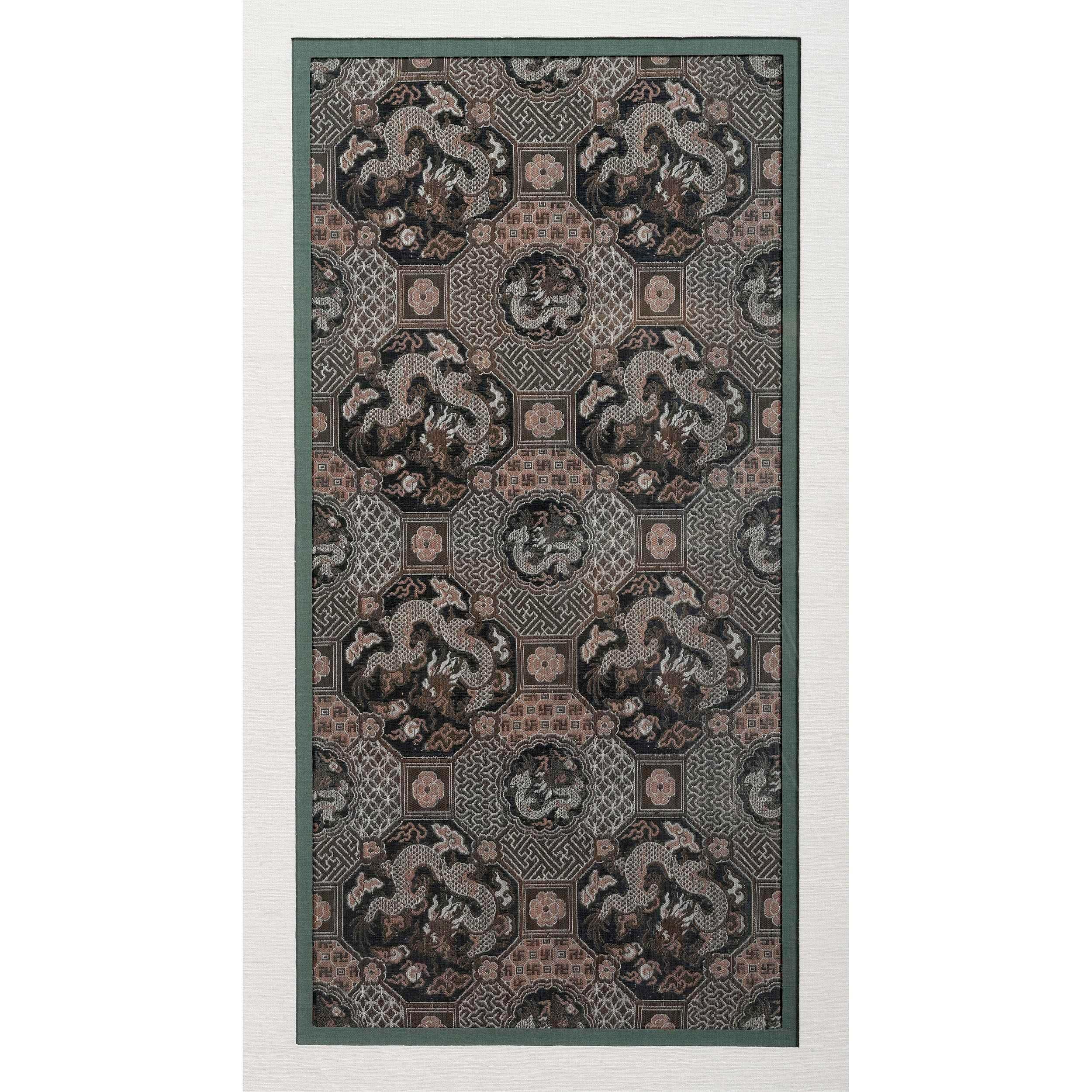 Antique Chinese brocade dragon panel from Imperial Qing Dynasty circa 19th century, beautifully presented with a linen mat and in a silvered wood shadow frame, is presented as an impressive piece of textile art. The finely woven brocade was a fabric