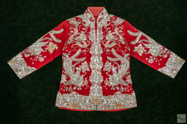 A framed vintage Chinese embroidered bridal jacket called 