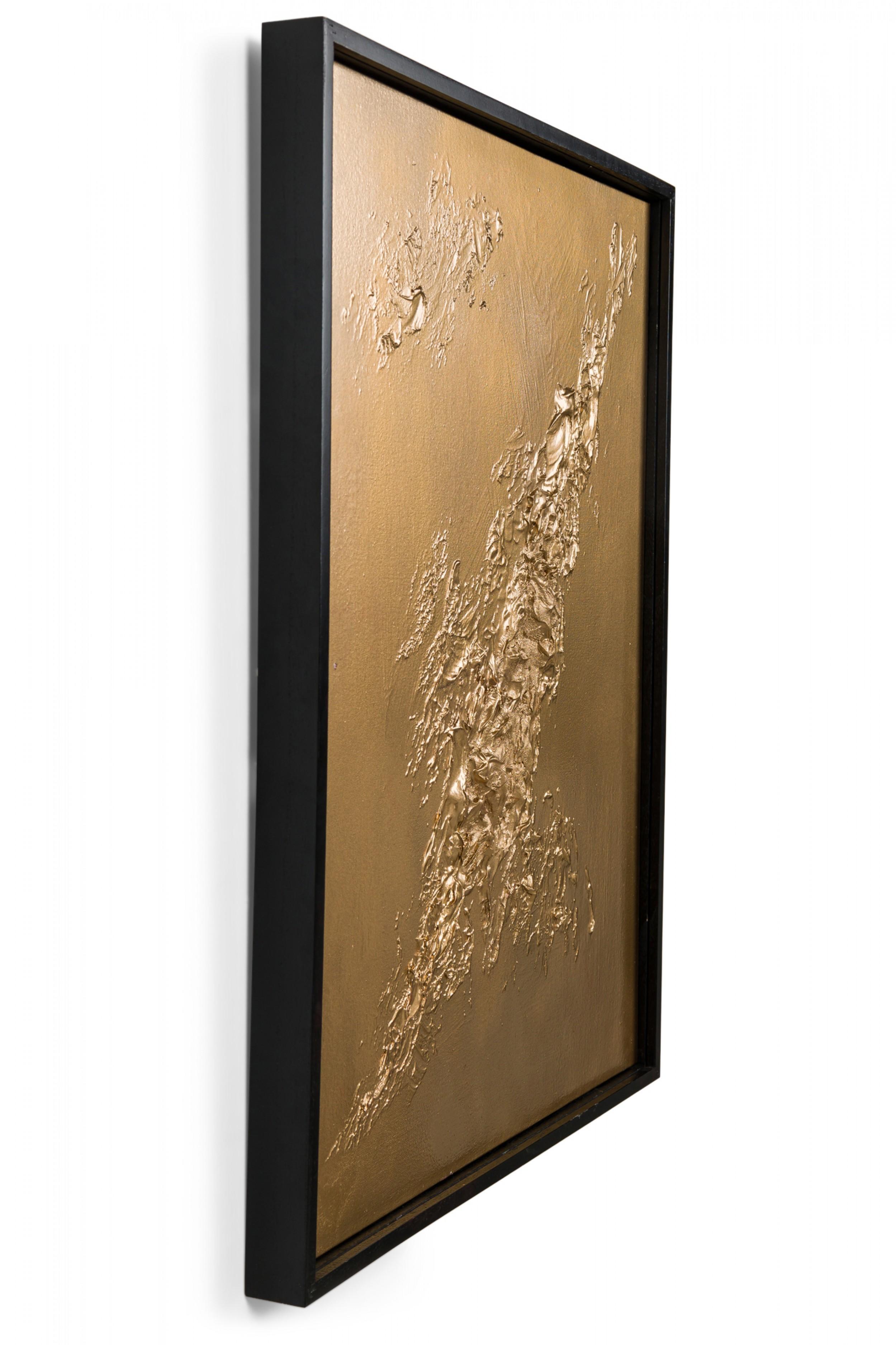 Contemporary mixed media abstract painting with textured 3D shapes painted gold on gold ground rectangular canvas in black wooden frame. (BARBARA KISKOVSKI).