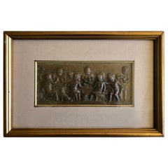 Framed Embossed Bronze of 9 Cherubs Dining with a Dog, Signed and Dated 1902