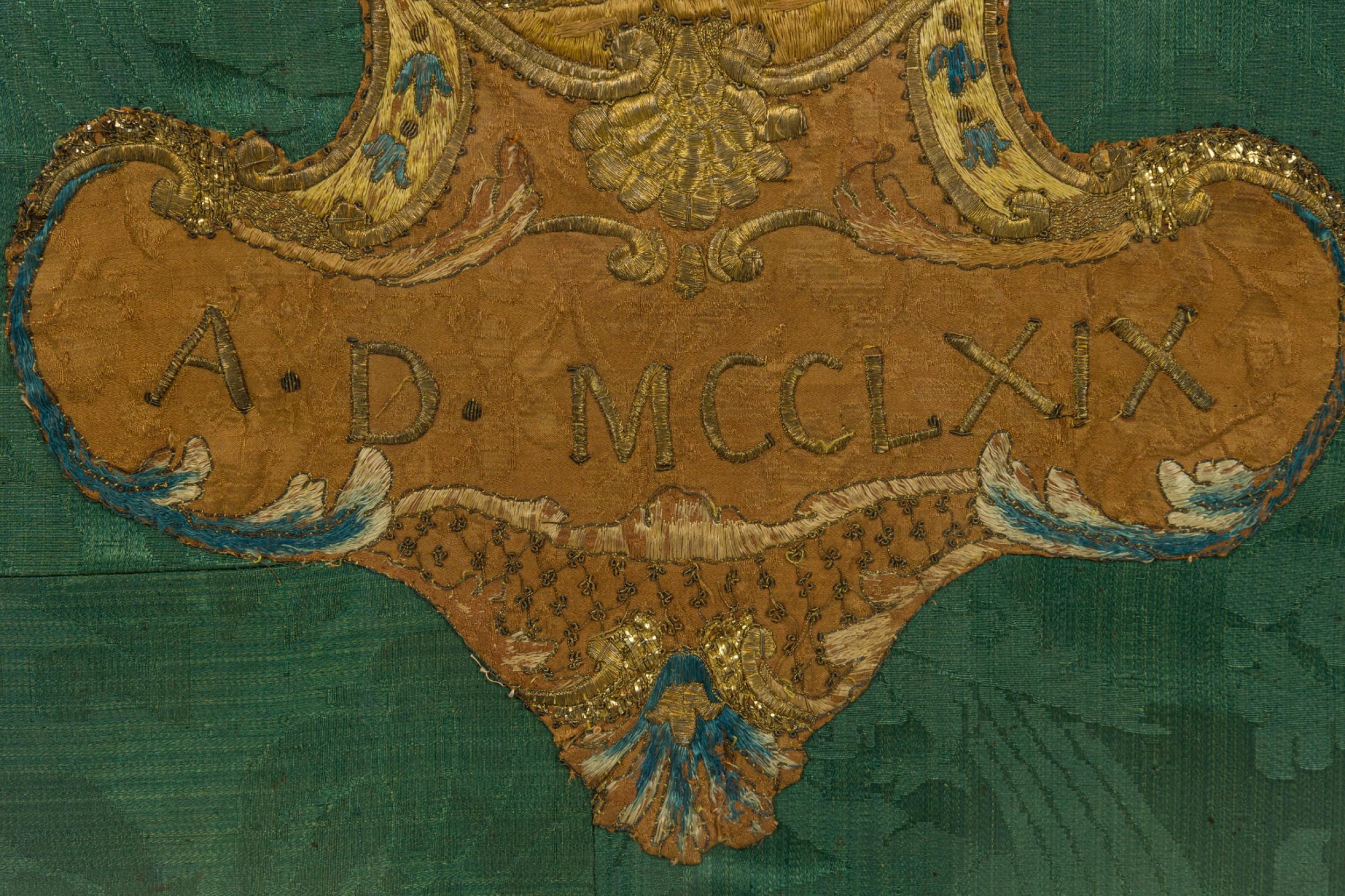 Italian Renaissance gold framed brown and gold embroidery with a green background having a crown like design with a date of AD MCCLXIX (1769) (Similar embroidery-REG9016A)