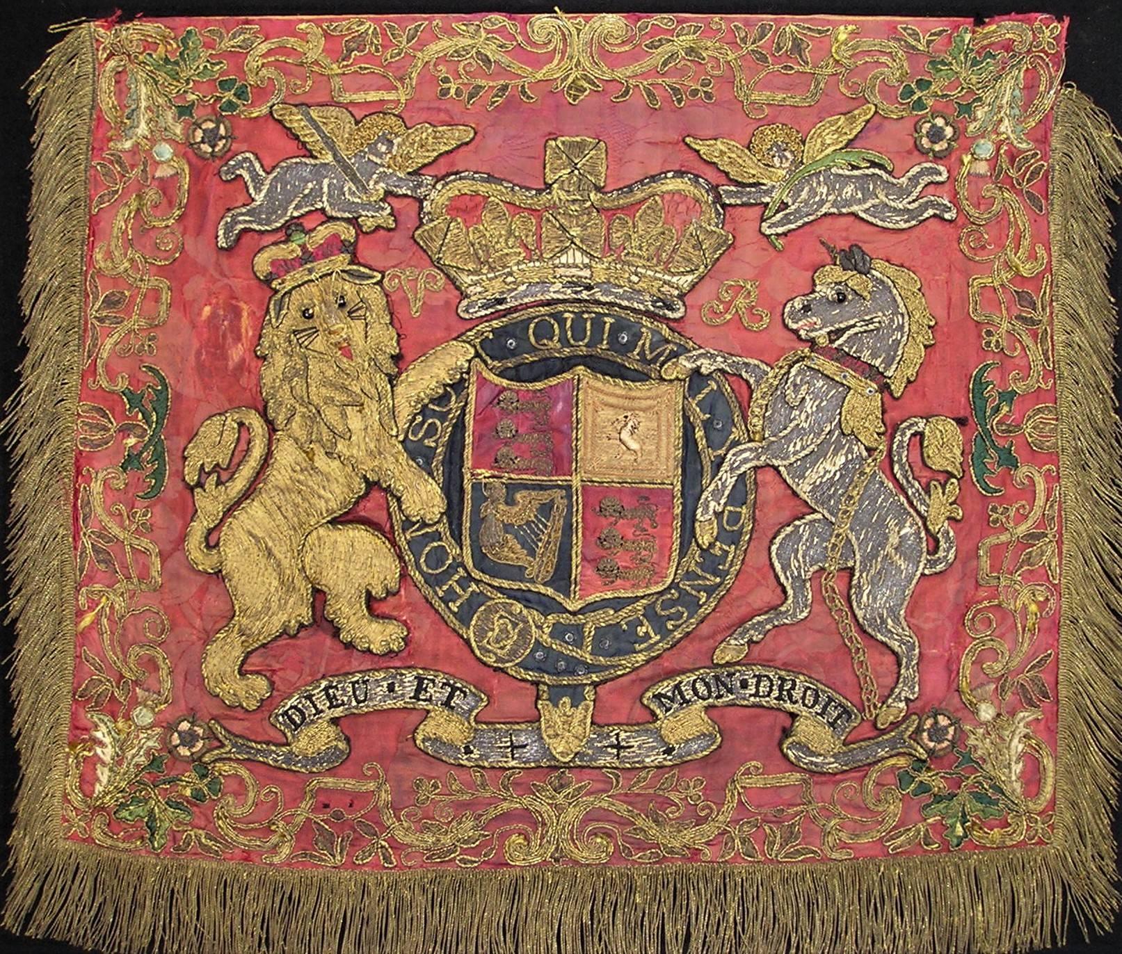 Embroidered Victorian England coat of arms panel, English, circa 1840. Silver and gilt threads on raised work applied to a silk ground. This embroidered panel intended for court use would have been produced by the
professional Broderers’ Guild. The
