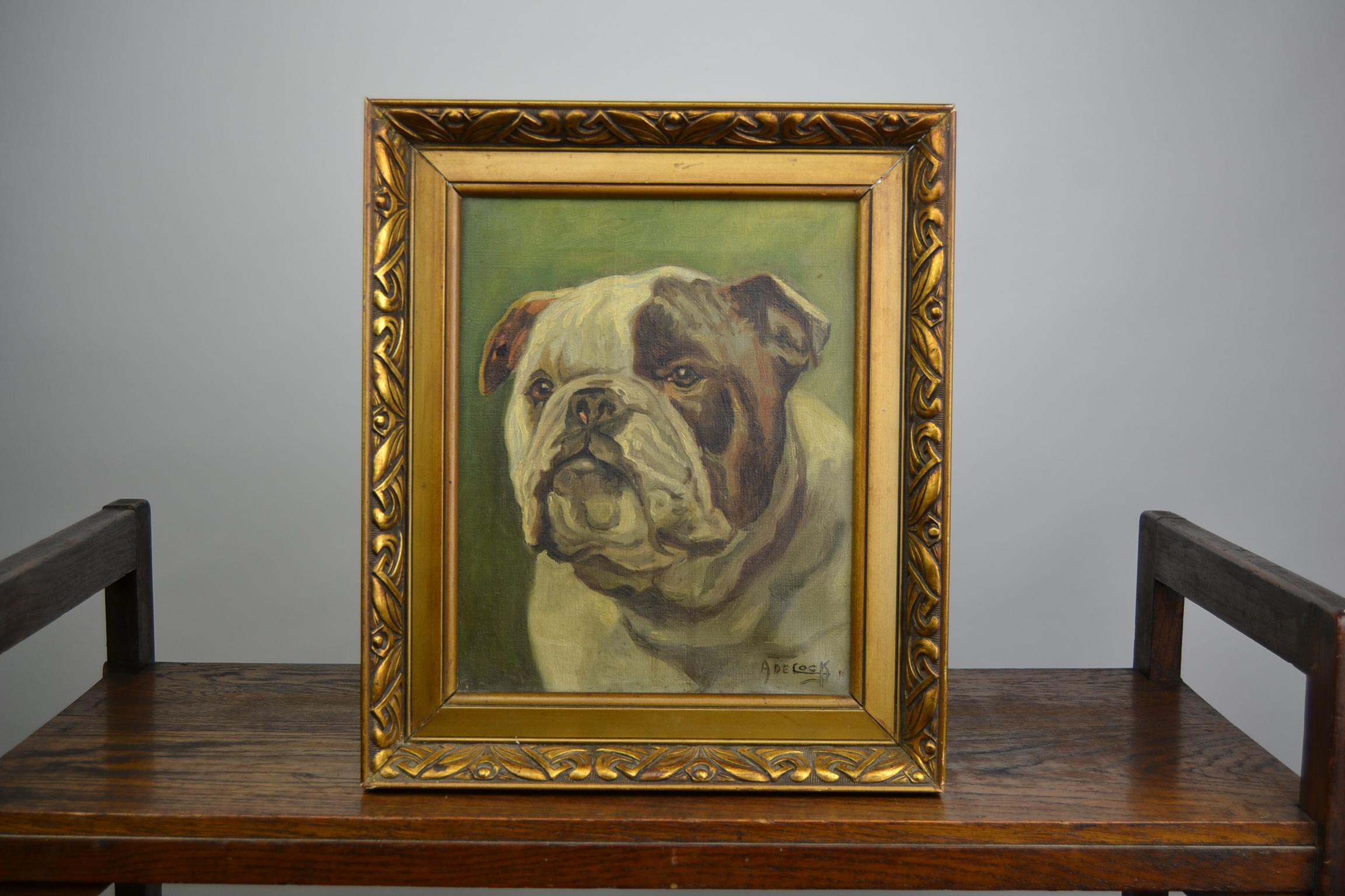 Awesome English Bulldog painting from the Art Deco Period. 
This Bulldog painting was made on canvas and has a stylish frame from wood and plaster. 
This piece of art is signed by his artist. 
As this is an old painting , the frame has some
