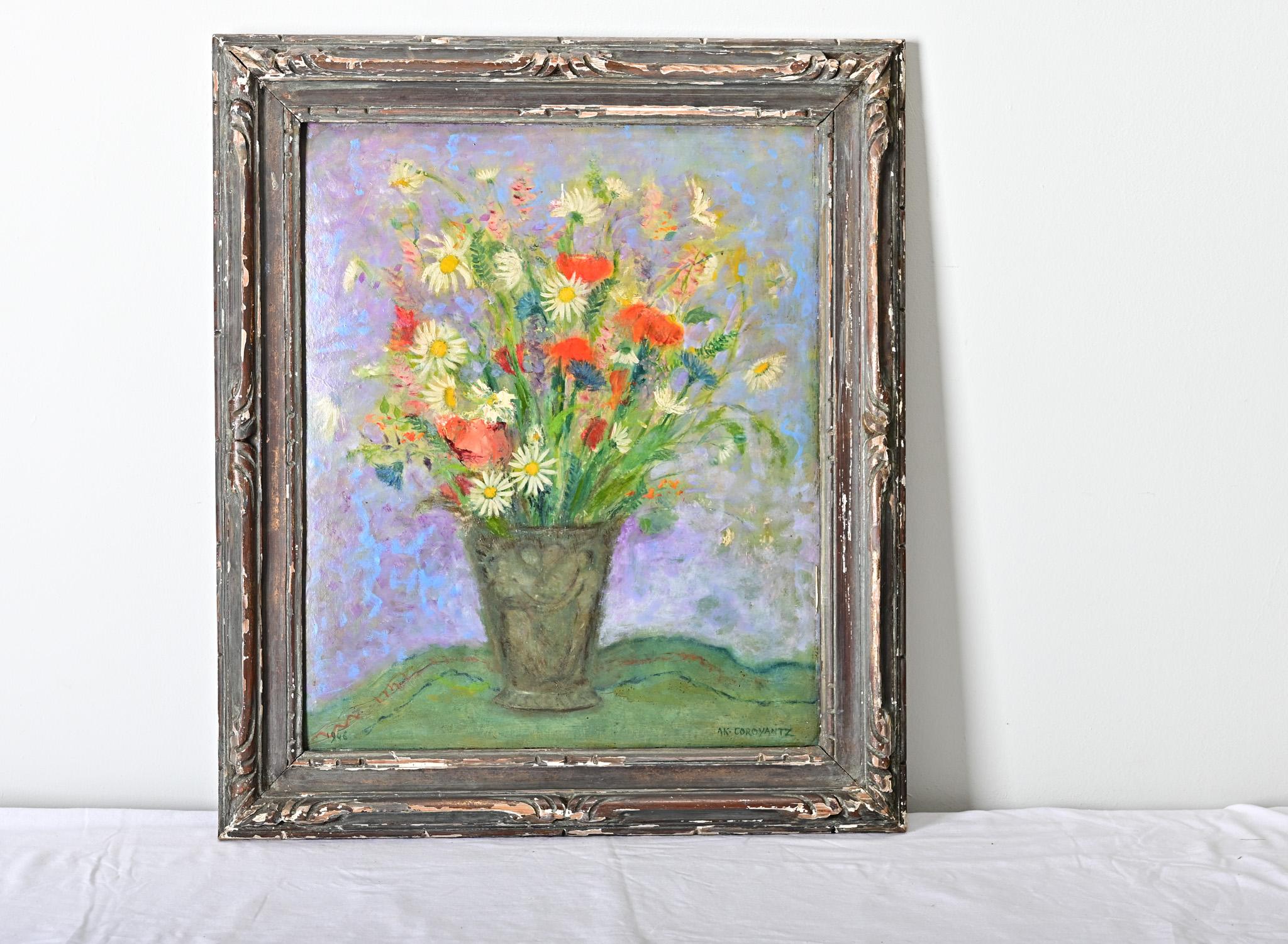 French vintage (mid-20th century) framed oil on board still-life painting of a whimsical bouquet of daisies and poppies. Artist’s signature “AK Coroyantz” for Ali Khan Coroyantz visible to the lower right corner. The ethereal, Impressionist