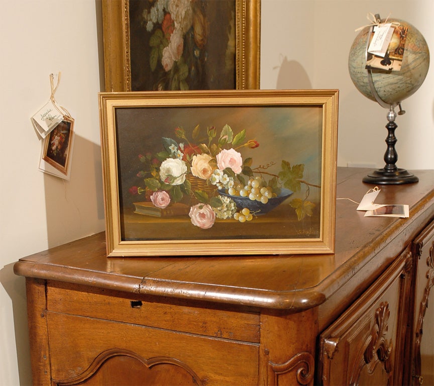 Framed French oil on canvas painting of flowers, circa 1910. Please note this item is an antique and is one of a kind.