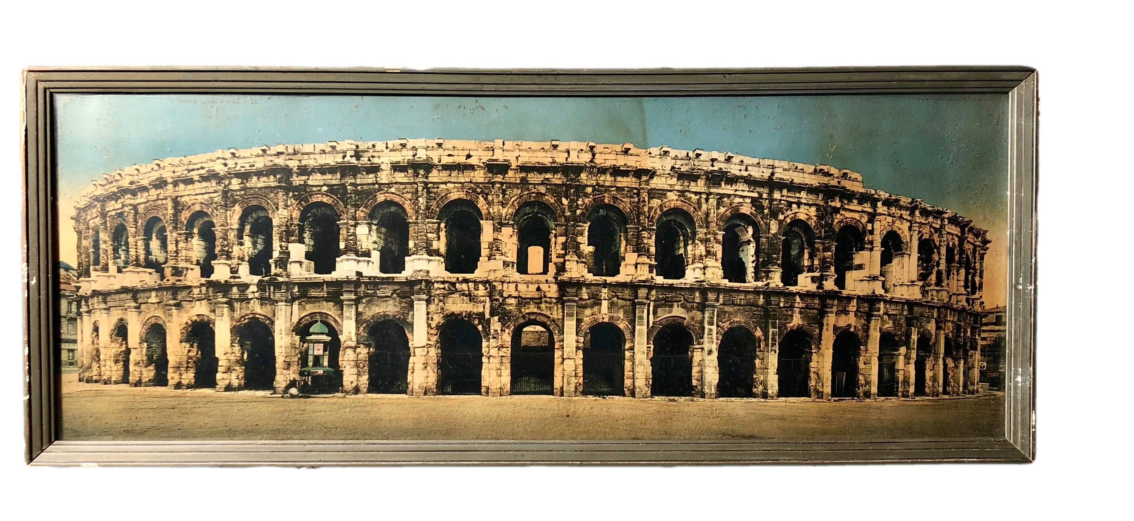 These are a set of two lovely French colorized souvenir photos. Both are framed in grey hand-painted wooden frames and are of the city of Nimes, showing the Roman arenas and the fountain gardens.
    