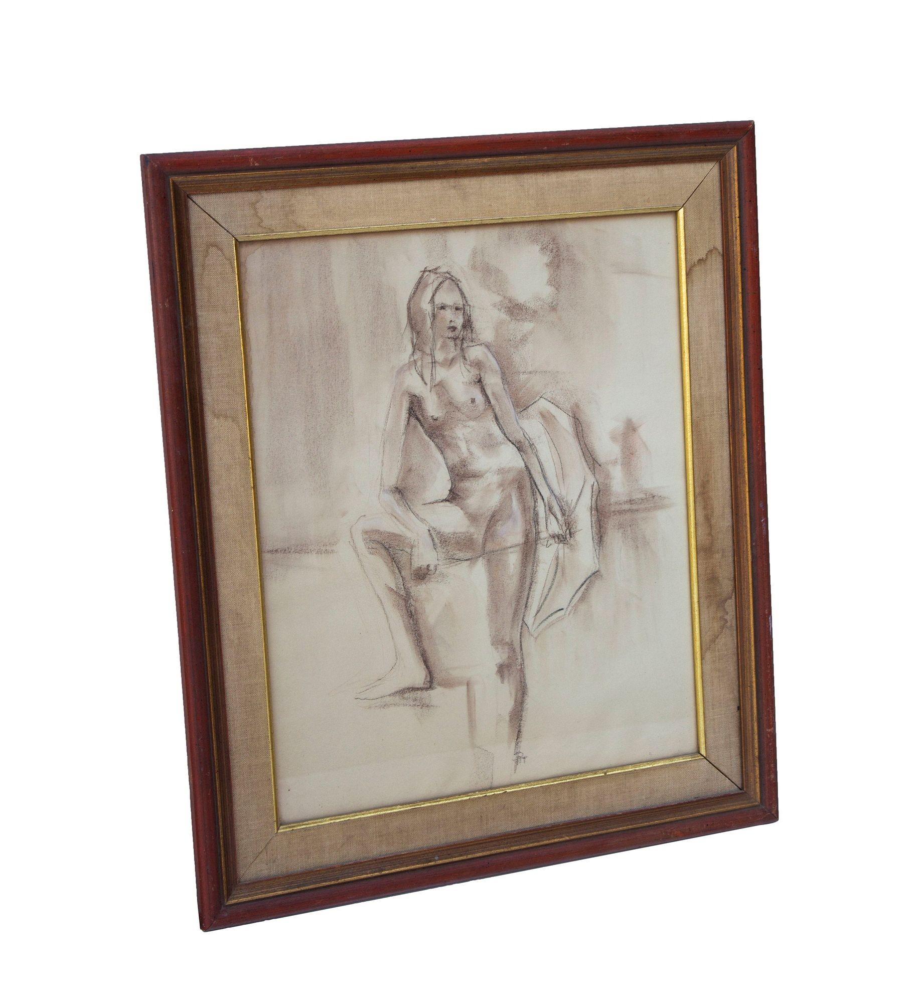 USA, 1970s
Full length female nude in conte crayon. The frame is in burnt sienna with a gilt inner edge and a natural linen matte. Illegible signature. Ready to hang. CONDITION NOTES: Some water marks to the linen matte and light marks to the