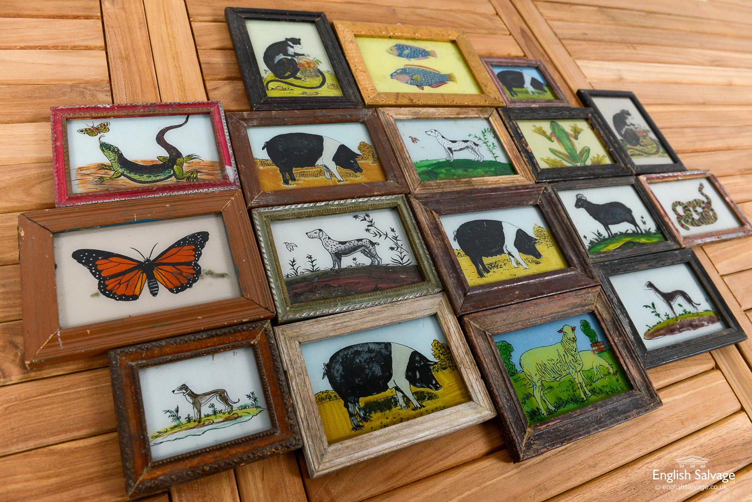 These Folk Art style pictures of animals are painted directly onto the glass and framed in reclaimed wood. The measurements provided below are approximate as each frame is a slightly different size. Age-related wear, scrapes and flaking paint to the
