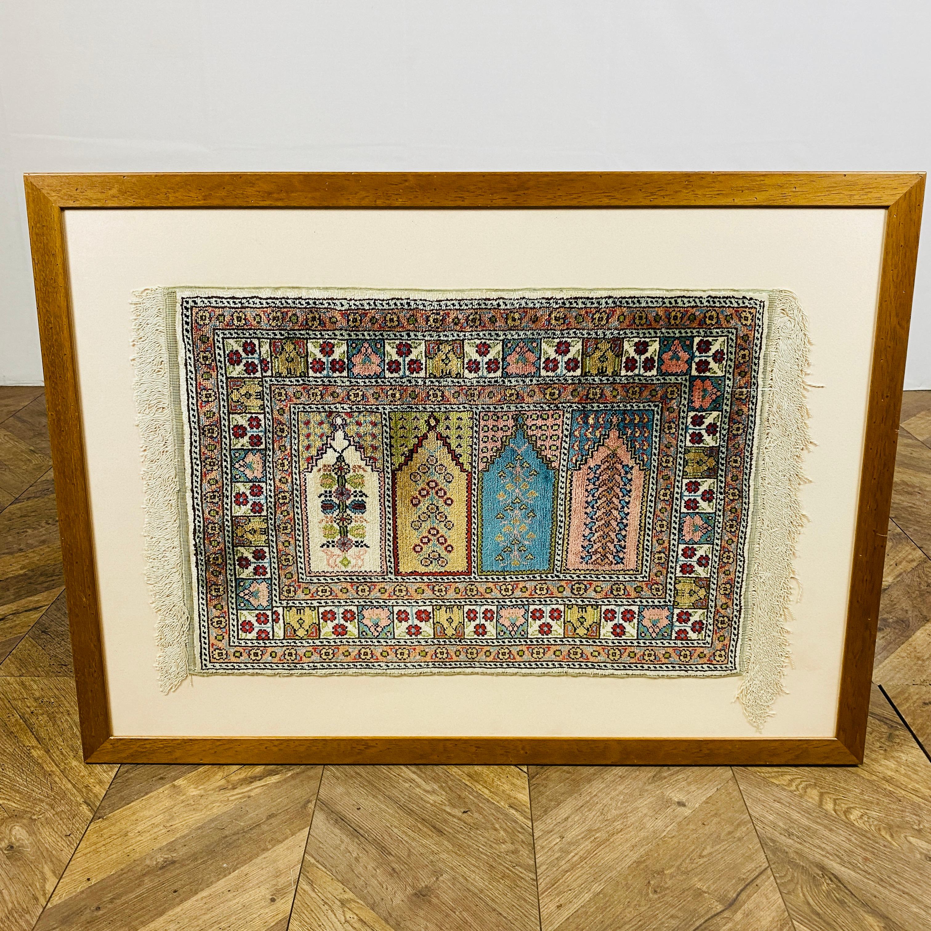 A Framed & Glazed Small Persian Rug, Made from Finely Knotted Silk.

These small rug could have been used by rug salesman to showcase designs and quality before production.

The frame is a good size and in good vintage condition.