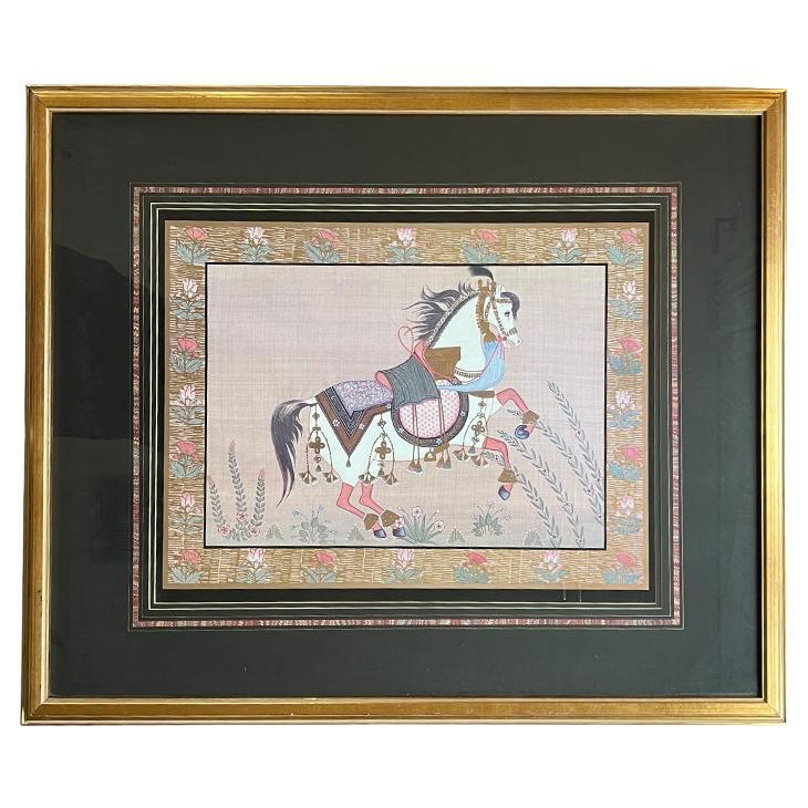 Peinture indienne à la gouache d'un cheval sur soie en rose, encadrée