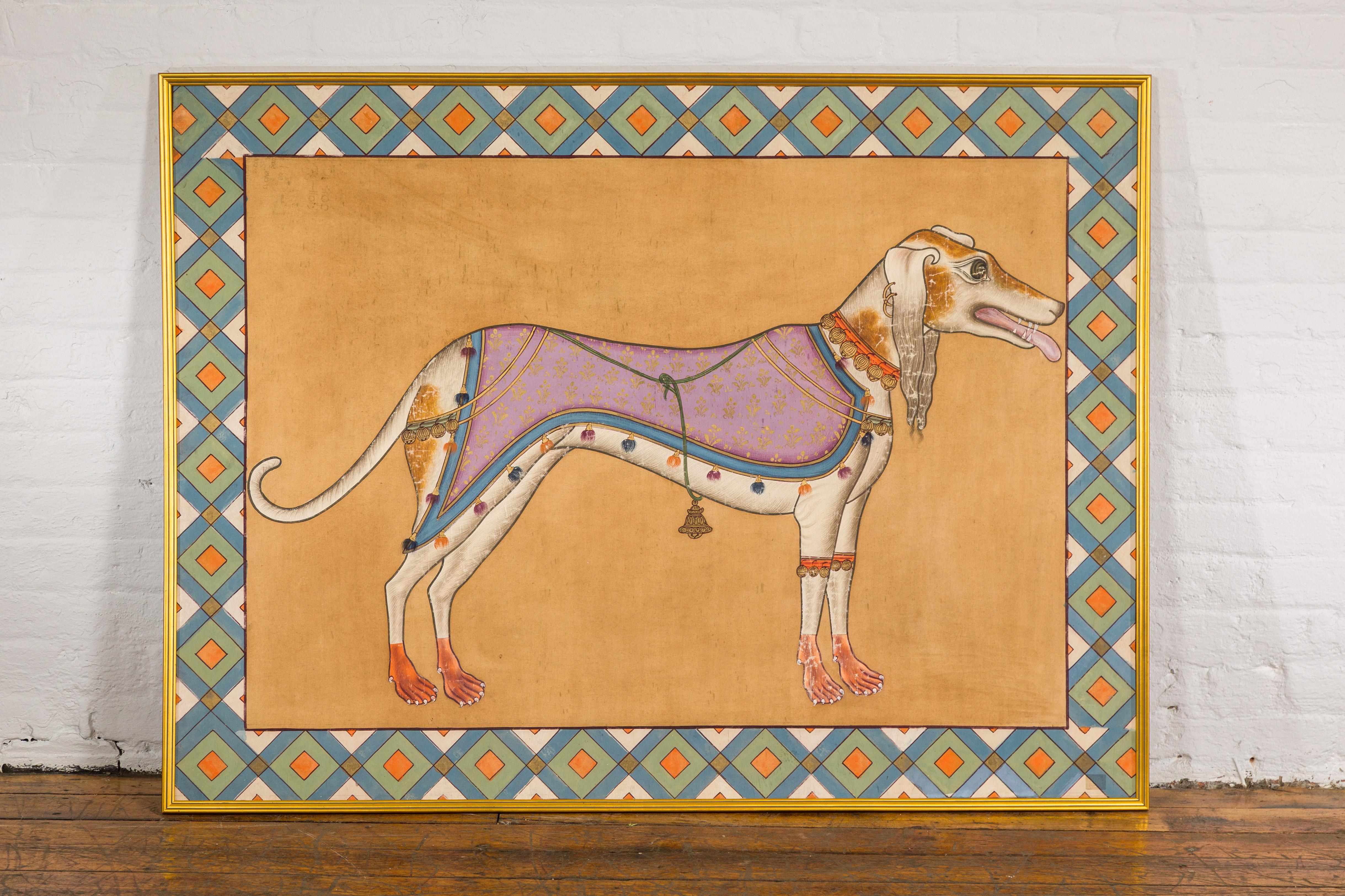 A vintage hand-painted Indian Royal Greyhound Dog mounted on fabric and set inside a gilded frame. A captivating depiction of regality and elegance, this vintage hand-painted Indian Royal Greyhound Dog exudes an ethereal charm. The graceful canine