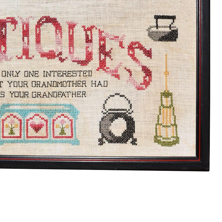 A fun hand-stitched cross stitch sampler. Framed in a wooden frame, it is stitched with:

