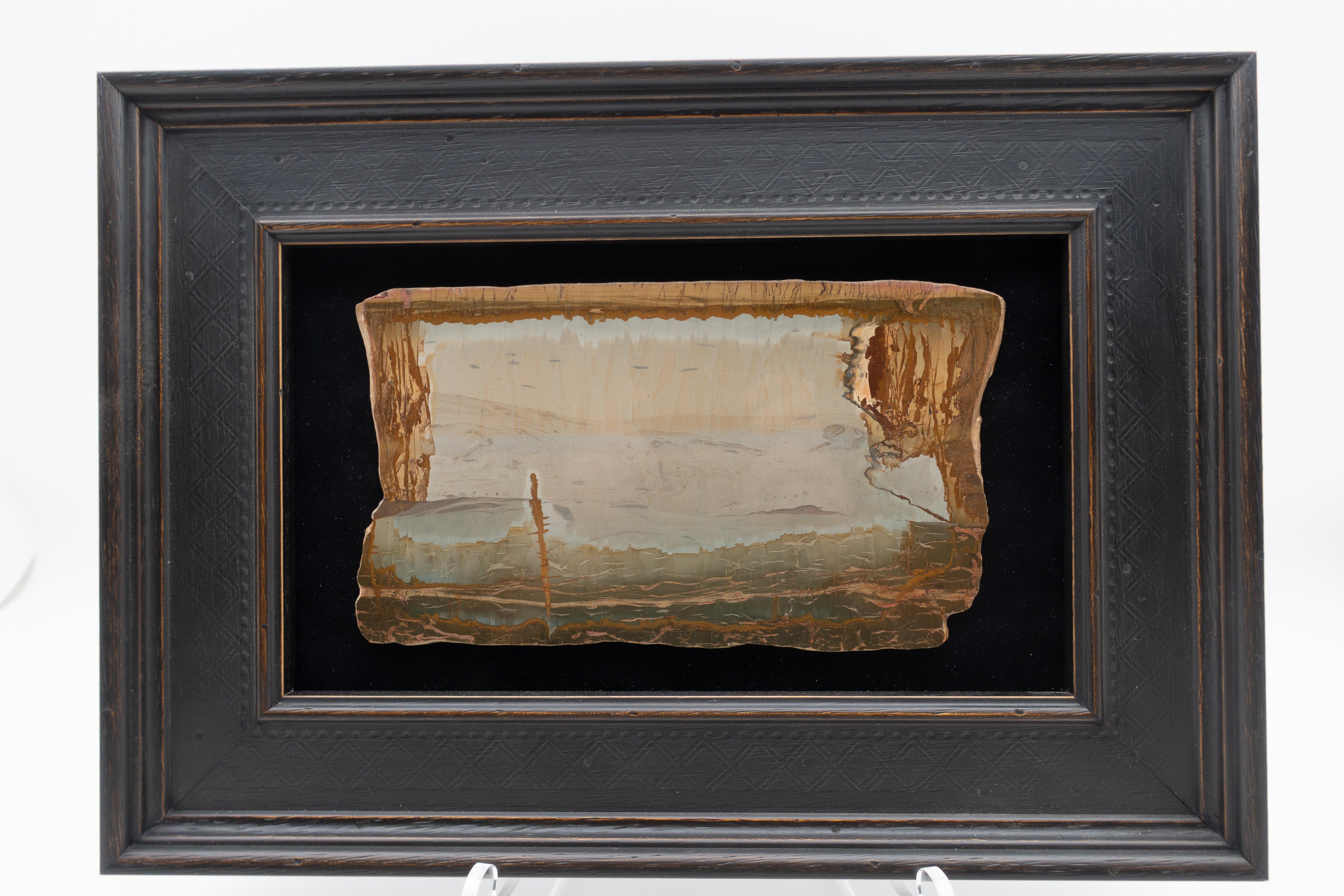 Framed slice of pietra paesina, also known as landscape stone or ruin marble. Pietra paesina is a kind of limestone or marble originating mostly from Florence territory whose natural appearance gives the impression of a ruined landscape painting. It