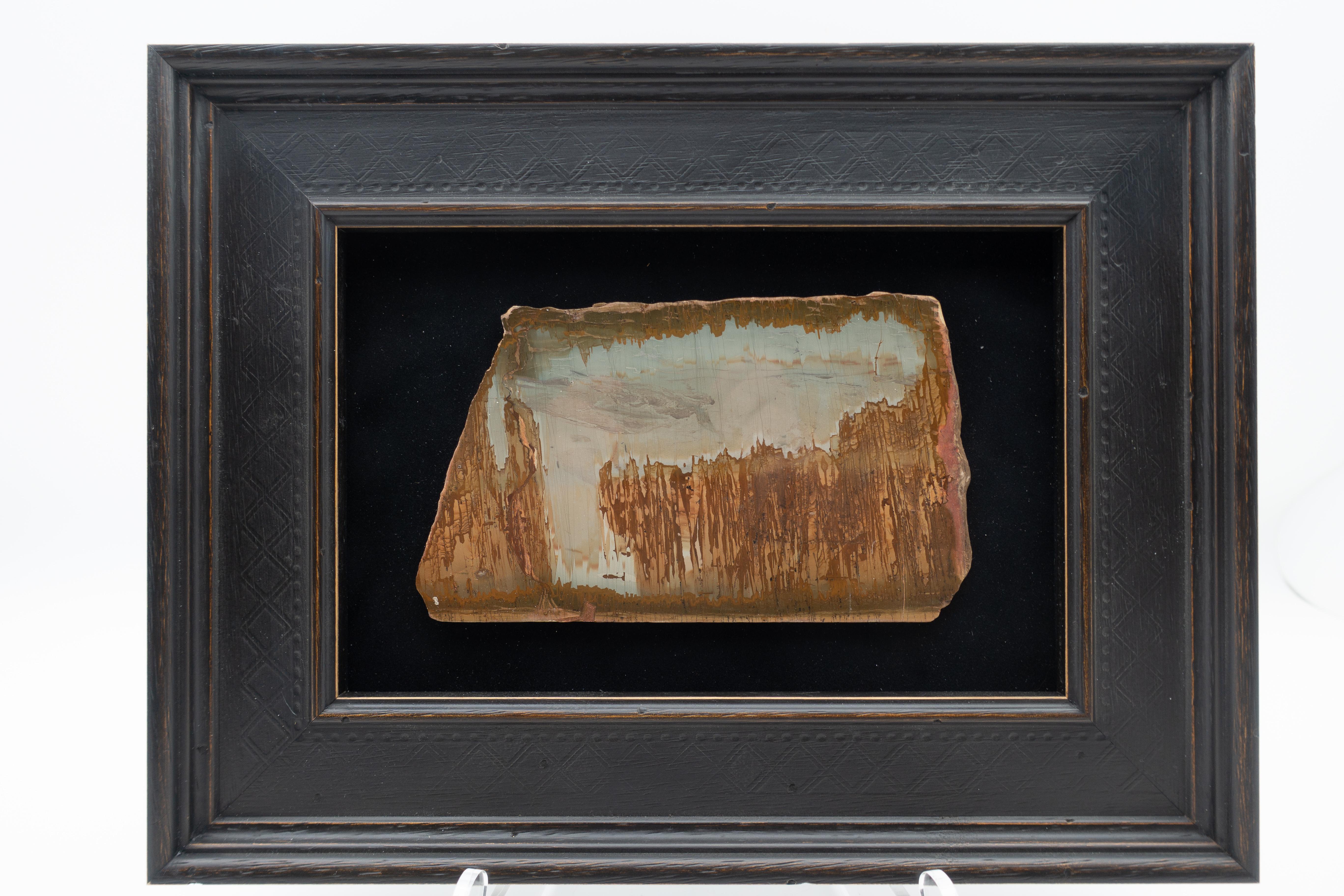 Framed slice of pietra paesina, also known as landscape stone or ruin marble. Pietra paesina is a kind of limestone or marble originating mostly from Florence territory, whose natural appearance gives the impression of a ruined landscape painting.