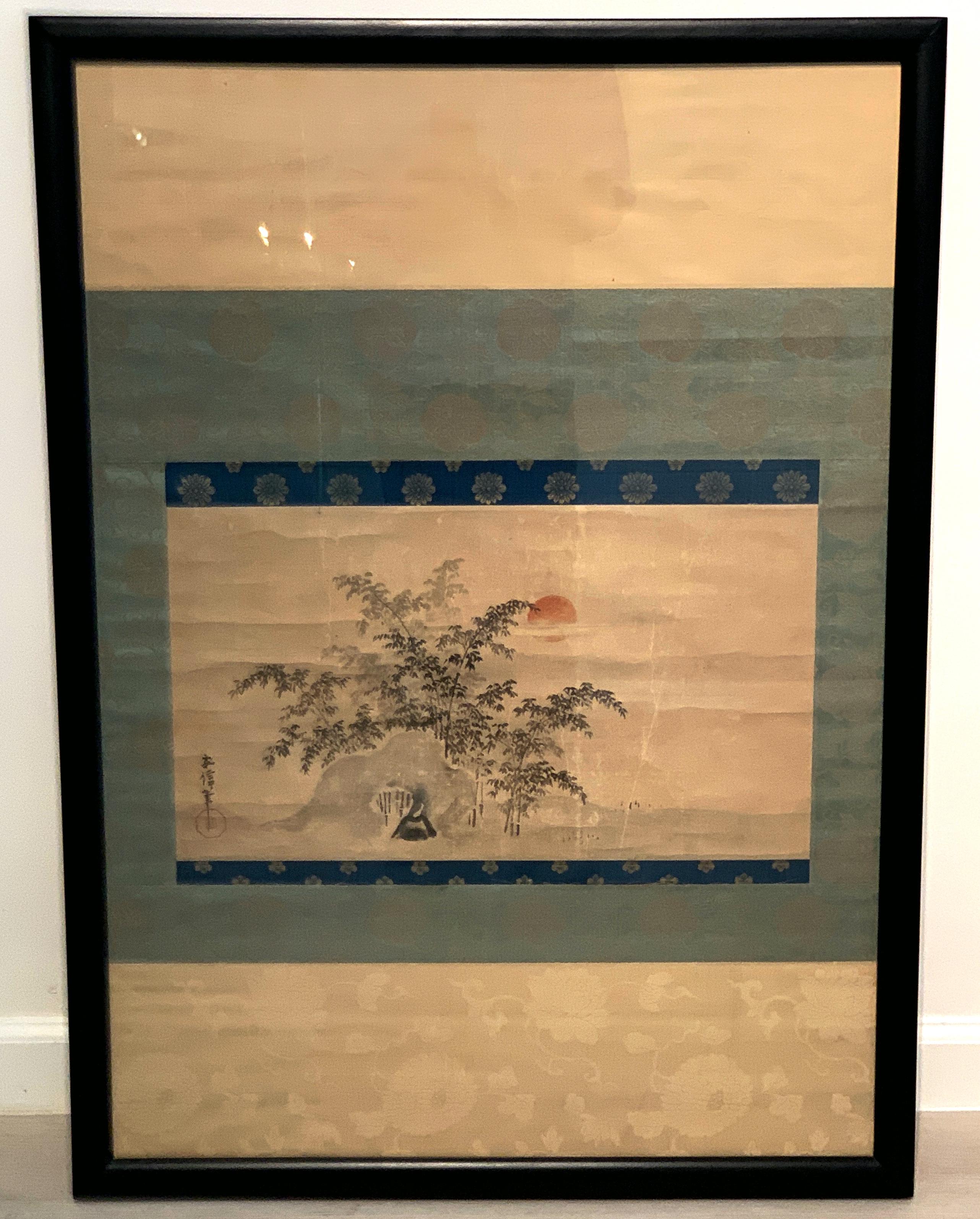 A charming Japanese sumi-e ink and color scroll painting, mounted, framed and glazed, signed Yasunobu, late Edo or early Meiji Period, mid-19th century.

The scroll painting depicting a stand of soaring bamboo behind a natural rock formation. In