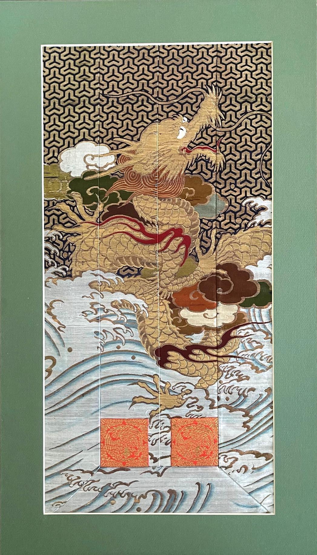 A framed Japanese woven textile circa late 19th century of Meiji Period. Likely a fragment of a priest robe or kesa, the multi-paneled textile was finely woven with gold foiled threads that depicts a five-clawed dragon slithering in the clouds and