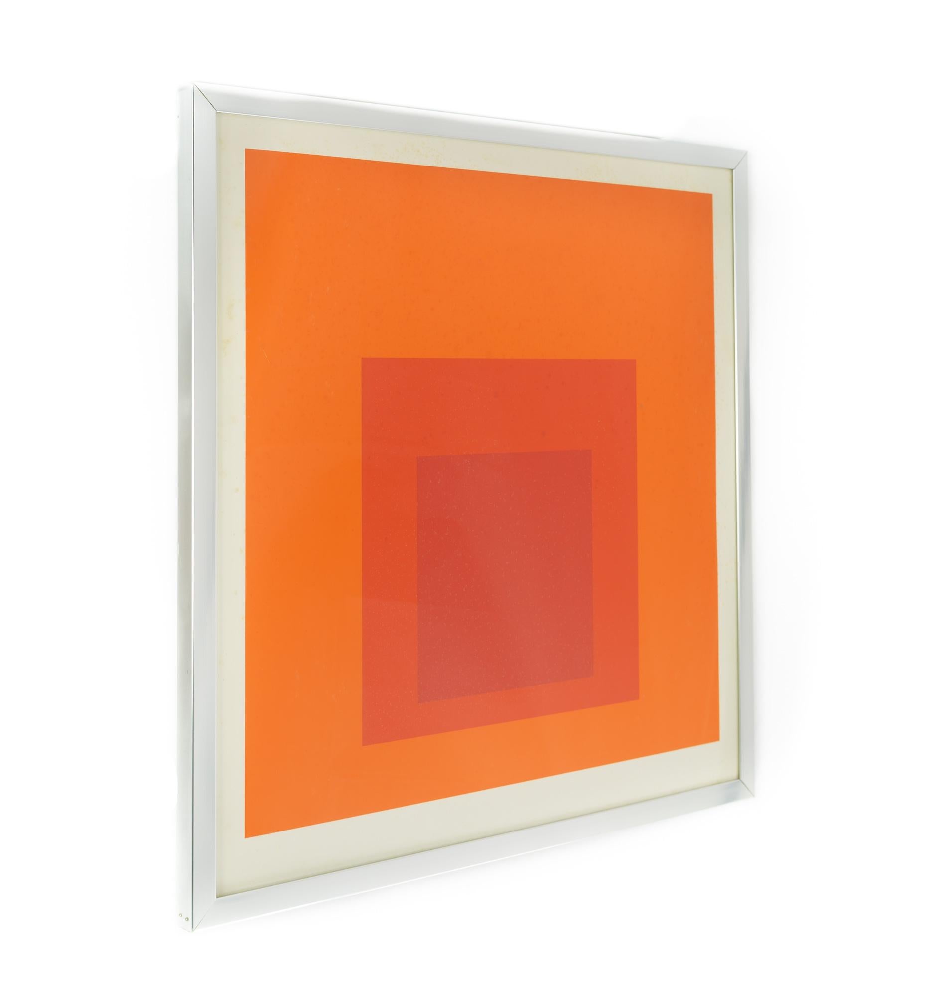 Framed Josef Albers 'Homage to the Square' mid century red/orange print

This piece measures: 27.75 wide x 1.25 deep x 28.25 inches high

Great vintage condition

We take our photos in a controlled lighting studio to show as much detail as