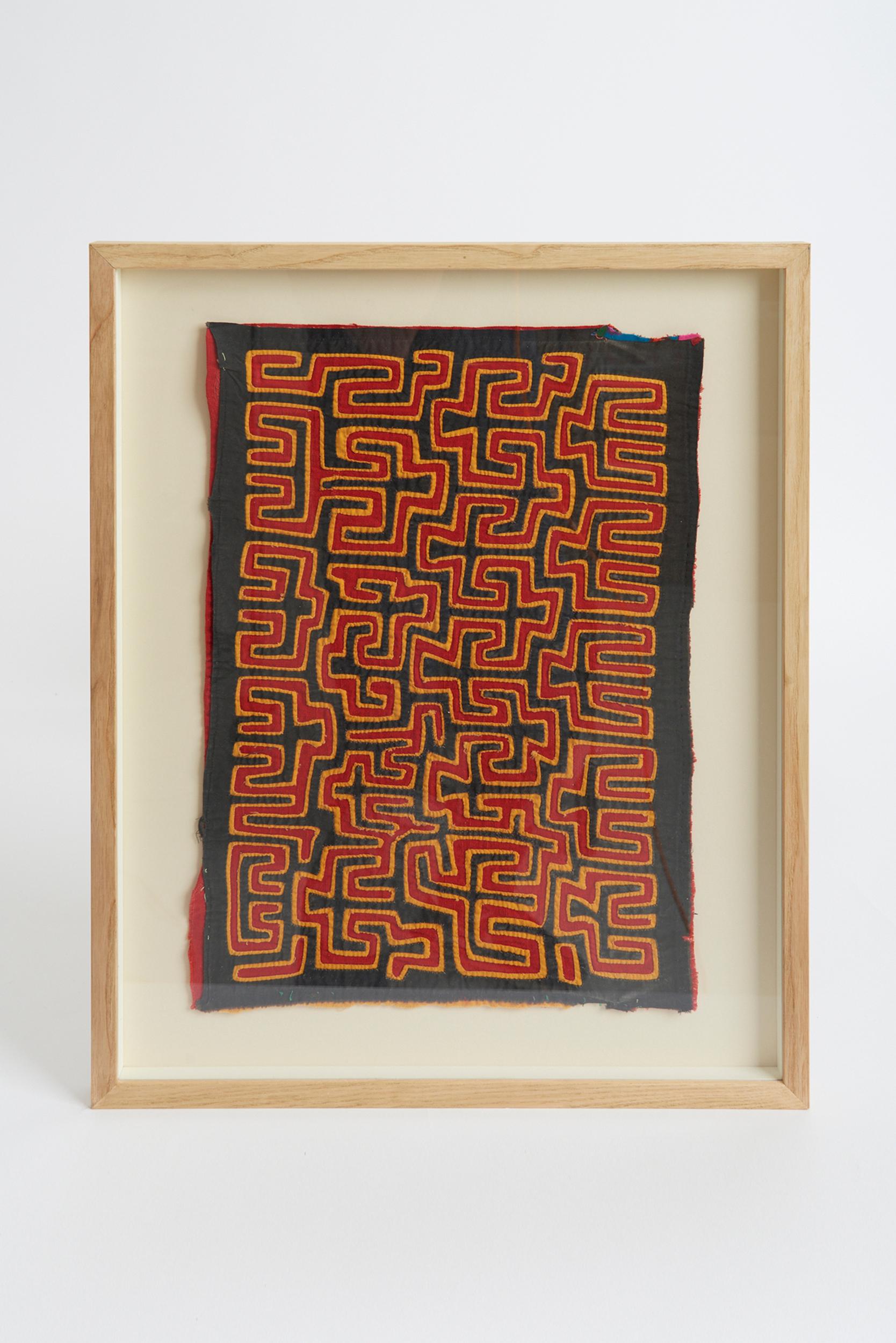 A framed Mola textile.
Traditional clothing of the indigenous Guna people from Panamá and Colombia.
South America, 1960s.
52.5 cm high by 42 cm wide by 2.5 cm depth