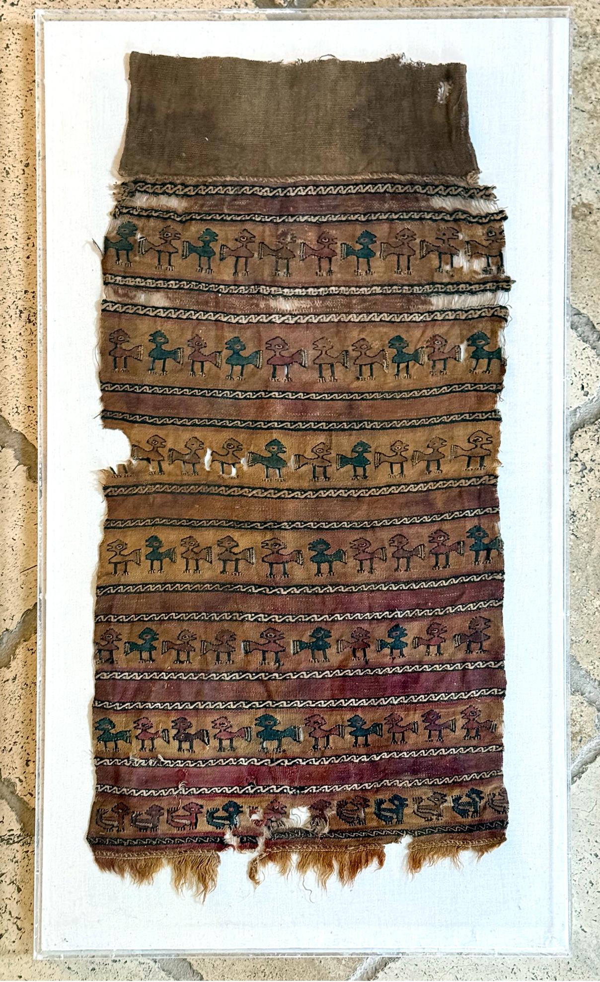 A large fragment of antique pre-Columbia textile panel from Chimu or Chancay culture located in Central and Northern Coast of nowadays Peru. Chancay culture thrived in the late Intermediate period/ late Horizon circa 1000-1470 CE until it was