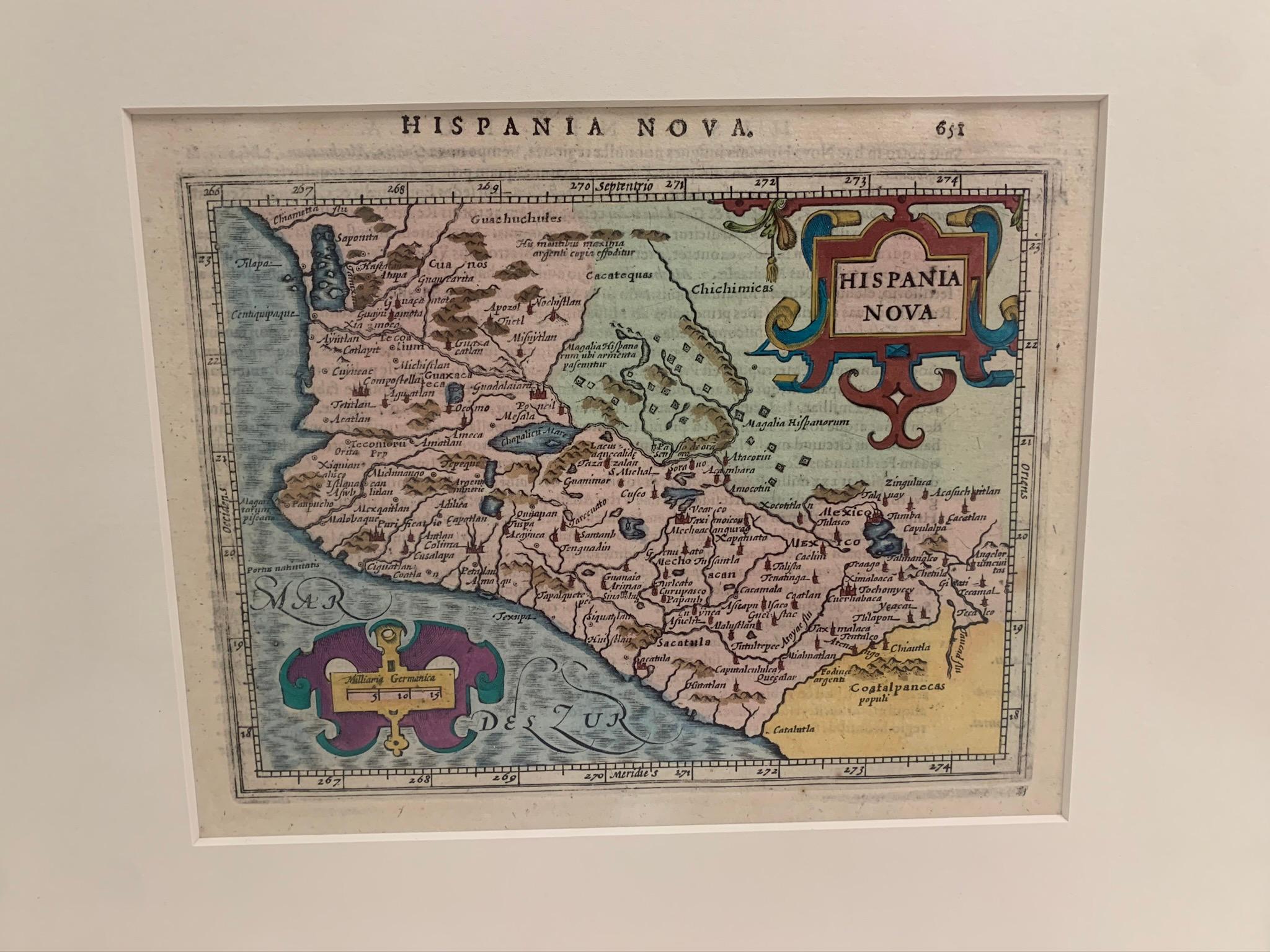 Framed colored example of this decorative and important minature map. Newly framed in brown wood frame with gold trim. 
Mercator Hondius “Atlas Minor” published in Amsterdam in 1648 at Jannsonius with a copy of the original german text on verso.
