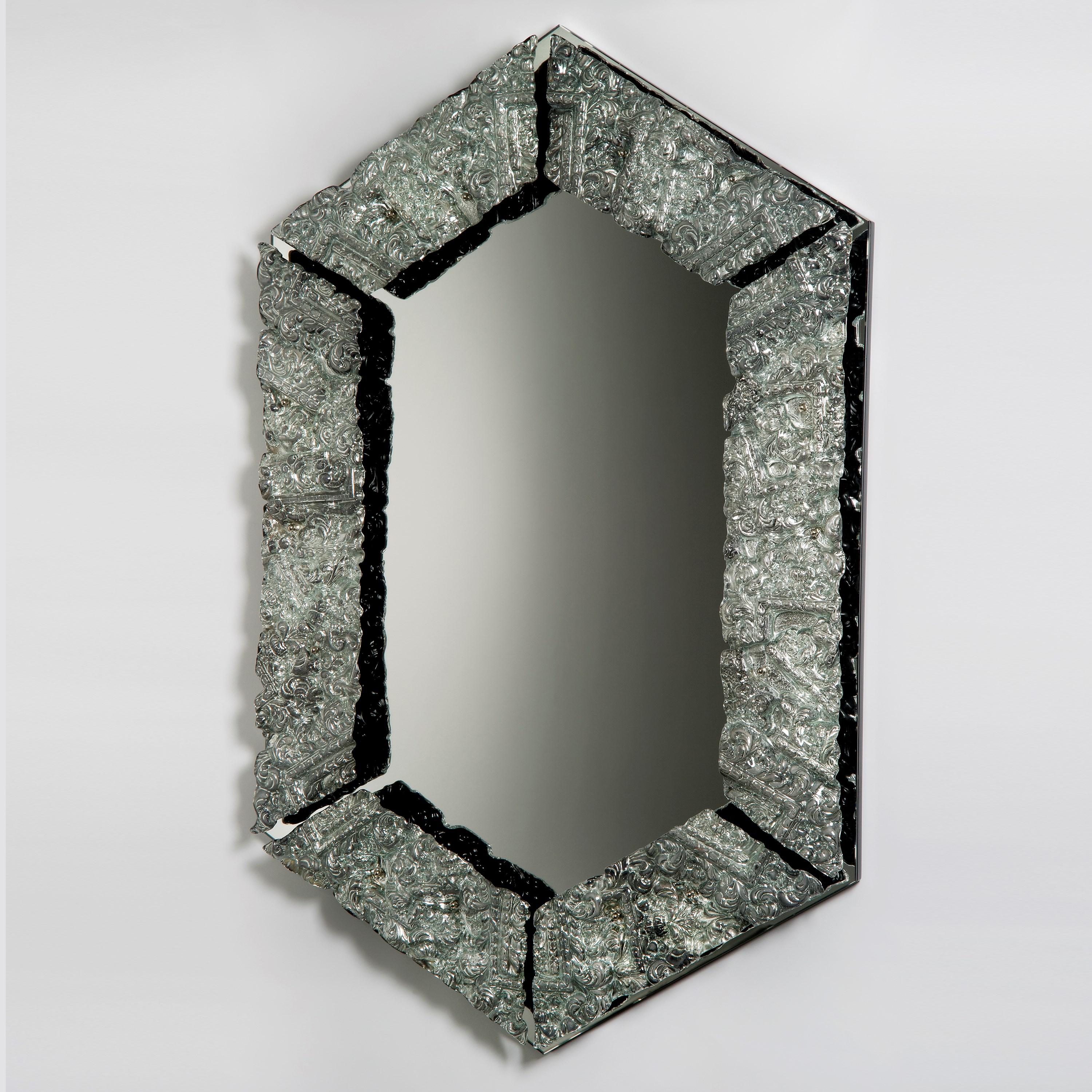 'Framed Mirror' is a unique mirror by the British artist, Brett Manley.

Each of Brett Manley's artworks are created as a result of trying to comprehend her chosen medium with greater understanding. The aim is to answer questions and elucidate the