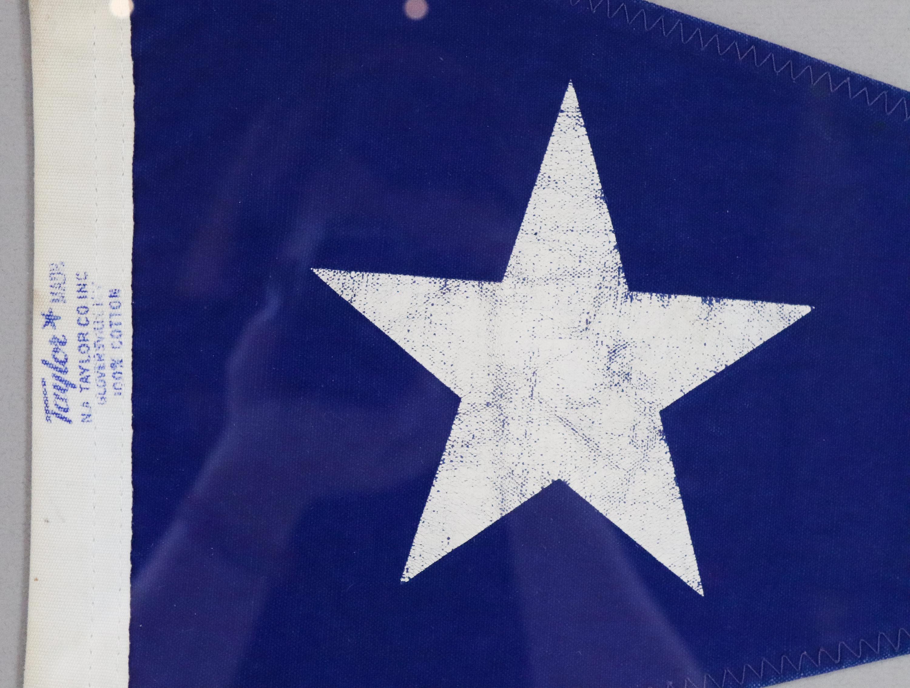 Framed nautical pennant, navy blue burgee flag with white star by Taylor. 100% cotton. Nicely framed. Measures: 22