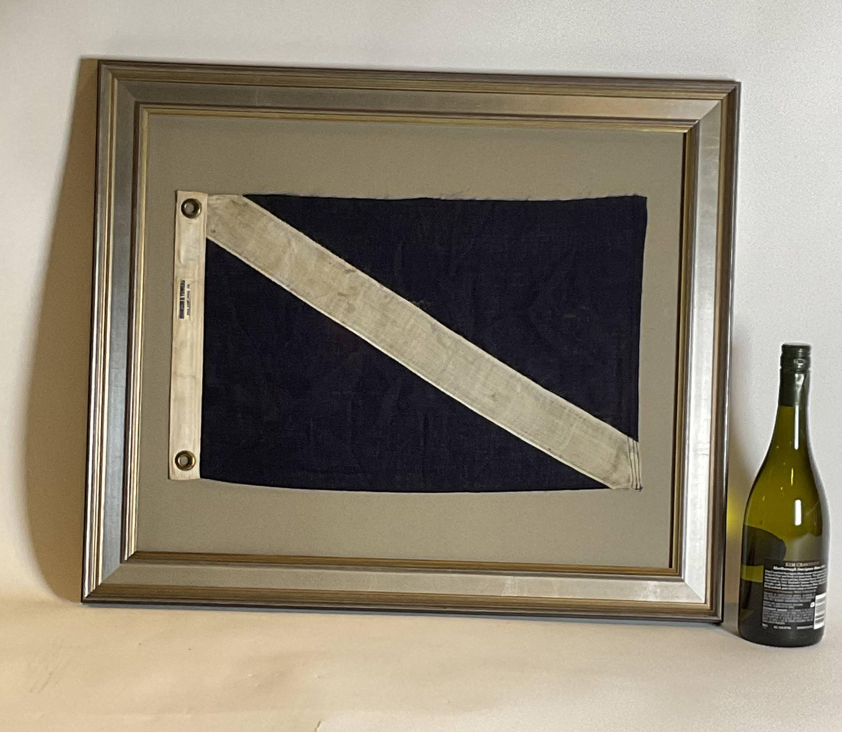 Framed nautical flag flown from dive vessels. This linen flag has a blue filled with white stripe. Canvas hoist with brass grommets. Matted and framed .

Weight: 6 lbs.
Overall Dimensions: 22