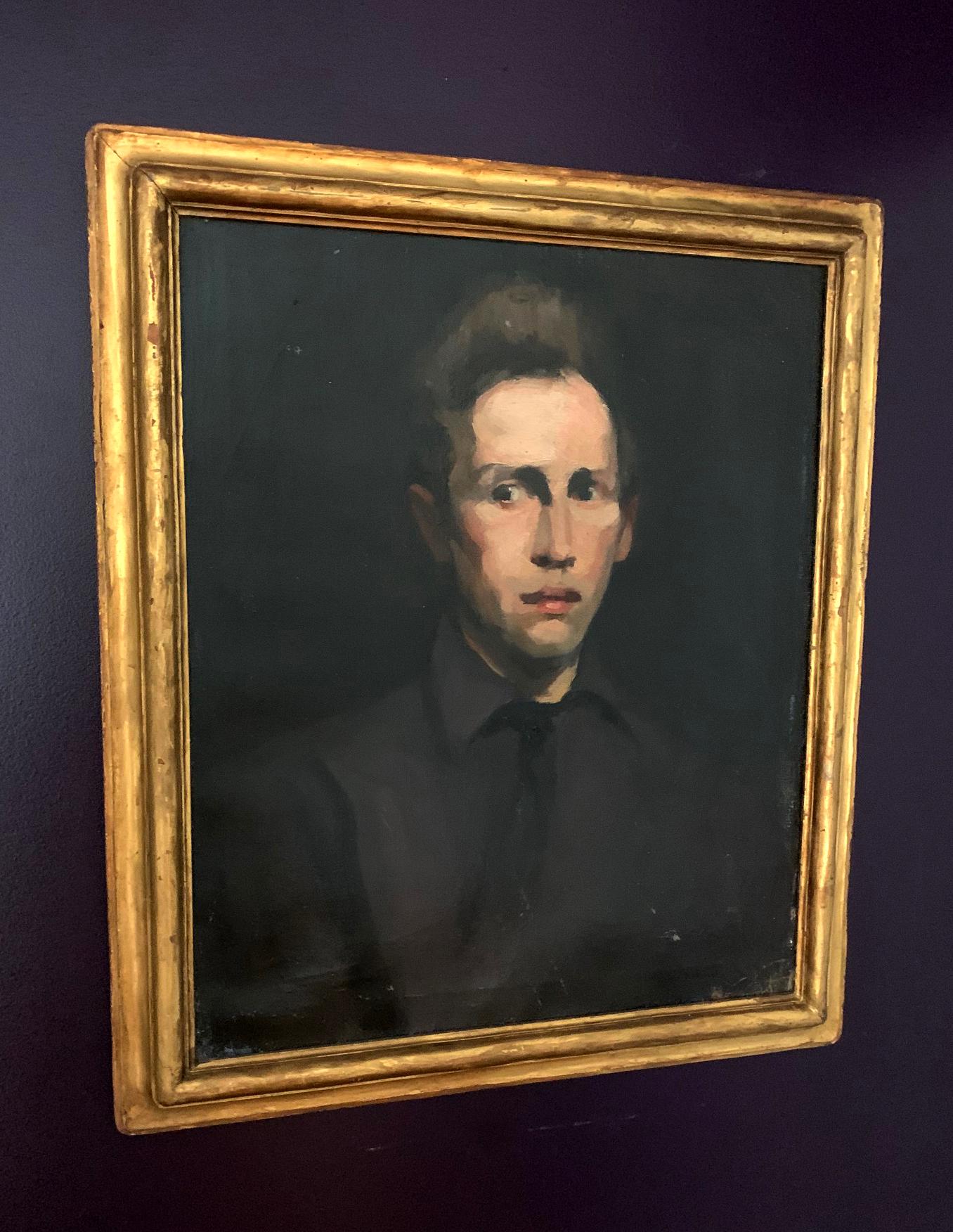 An oil painting depicting an unidentified young man by George Wesley Bellows (1882-1925), a member of American Ashcan School in the circle of Robert Henri. This portrait is in its original condition with the period frame. Signed G.Bellows BR on