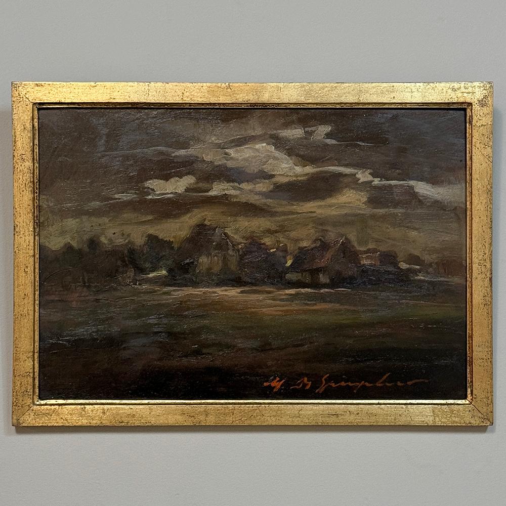 Framed Oil Painting on Panel by Marthe de Spiegeleir (1897-1991) is a wonderful post-impressionist work depicting a quaint country village illuminated by a full moon behind overcast skies.  One can imagine a hunter returning from the day ready to