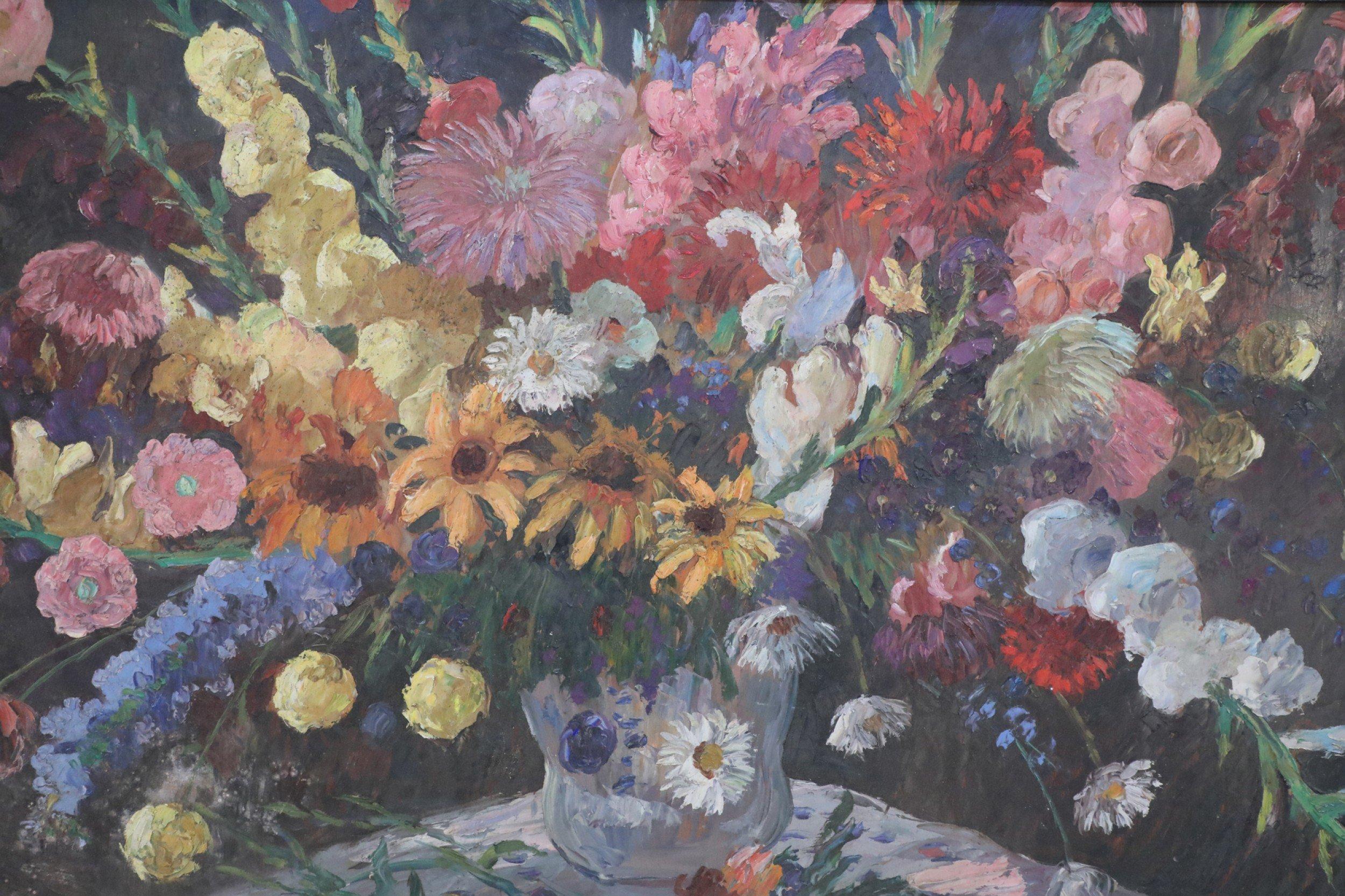 Mid-Century oil on canvas still life painting of a beige and blue vase filled with an abundance of flowers against a brown background in a rectangular black painted wooden frame.
 