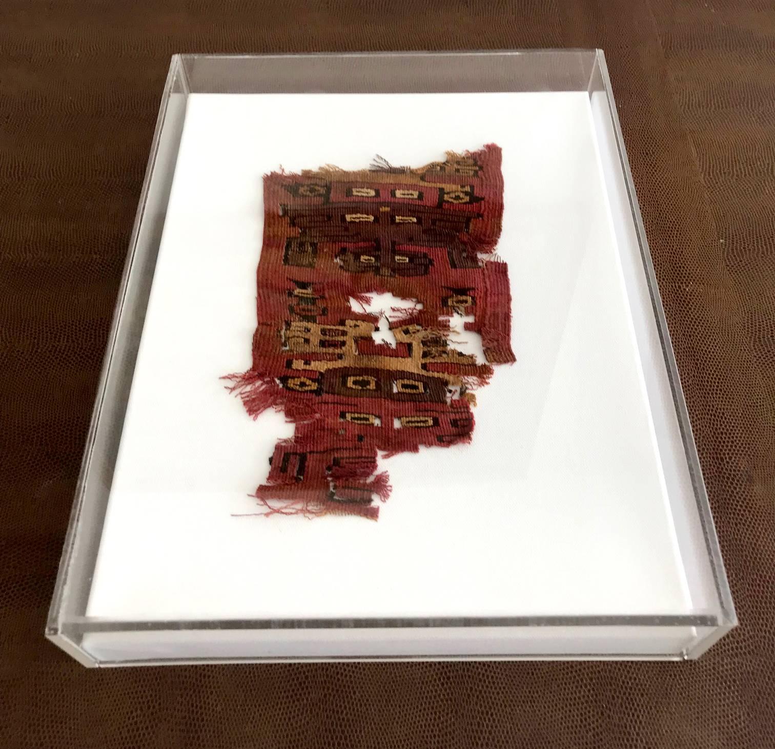 A piece of antique textile fragment from Pre-Columbian Peru, attributed to the Paracas culture, which flourished on the southern coast of the central Andes, Peru in around 600-150 B.C.E. and is one of the earliest known complex societies in South