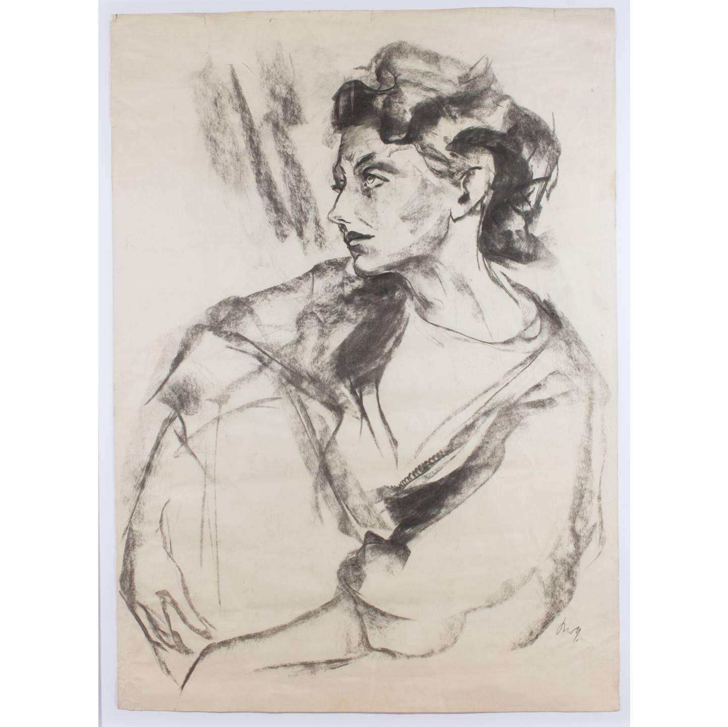 Discovered in a Parisian market on the Left Bank, this stunning charcoal portrait of a woman dates to the mid-twentieth century and is signed by the artist. We had it framed in an understated, yet versatile metallic champagne frame that works with