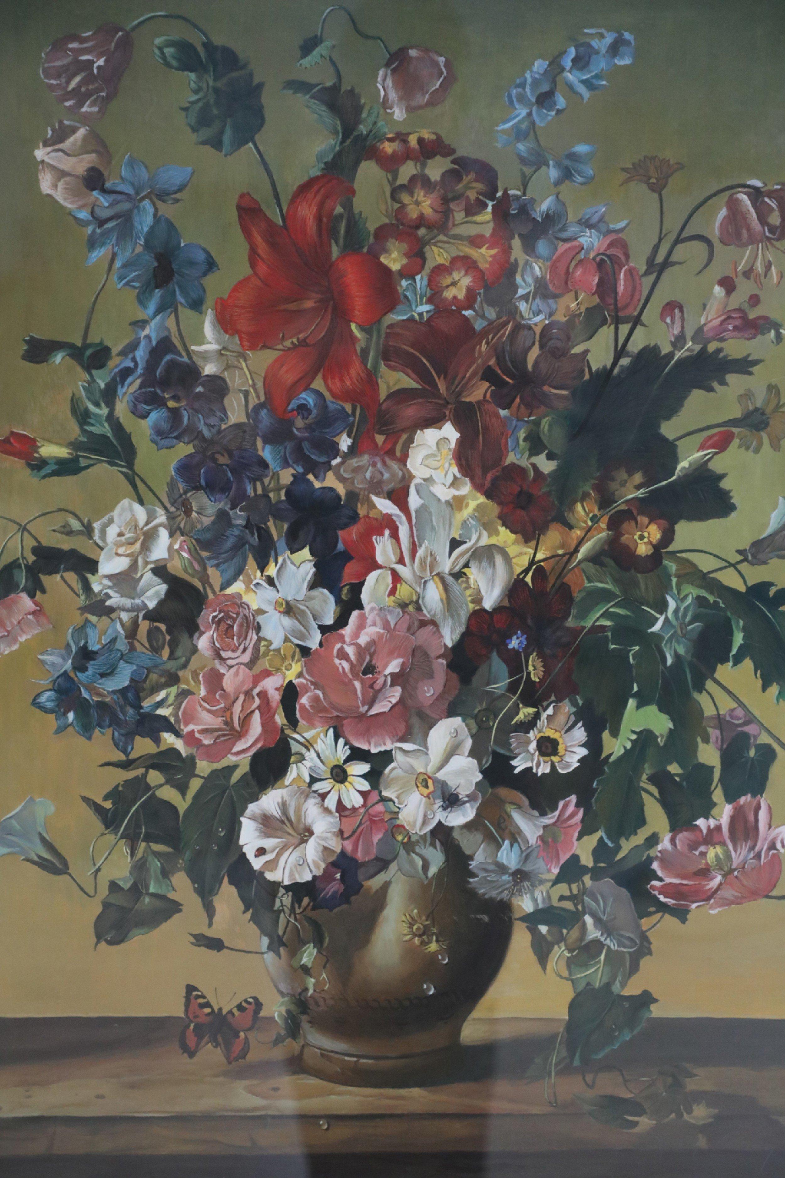 Mid-Century still life painting of a bouquet of assorted flowers in a brown vase on a table with butterflies and insects in a yellow and beige double mat and rectangular giltwood frame.
 