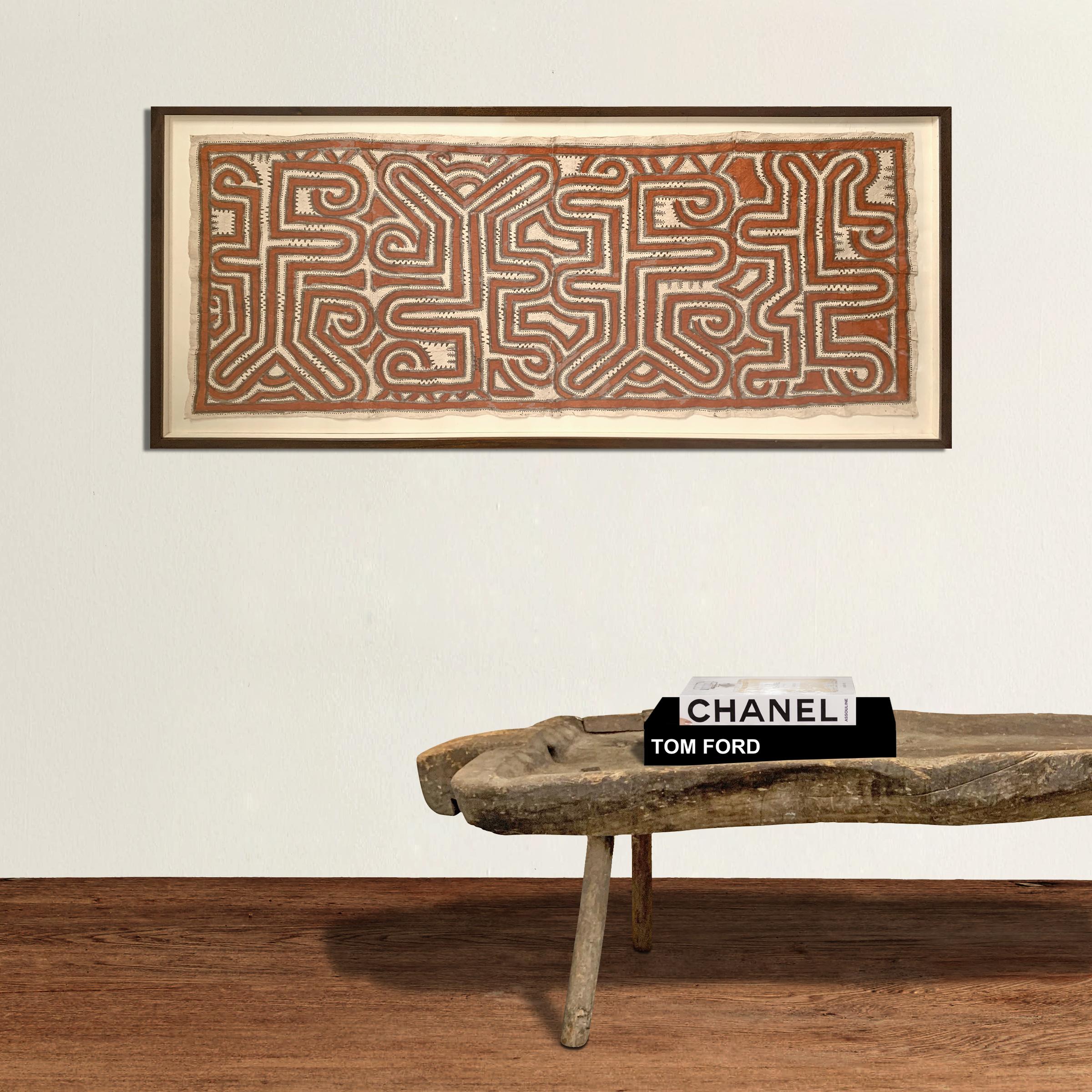 An incredible framed mid-20th century Tapa, or barkcloth, with hand painted red and black figurative icons, from the Kanak people of New Caledonia. New Caledonia is a French island territory in the South Pacific. Tapa are not woven textiles but,