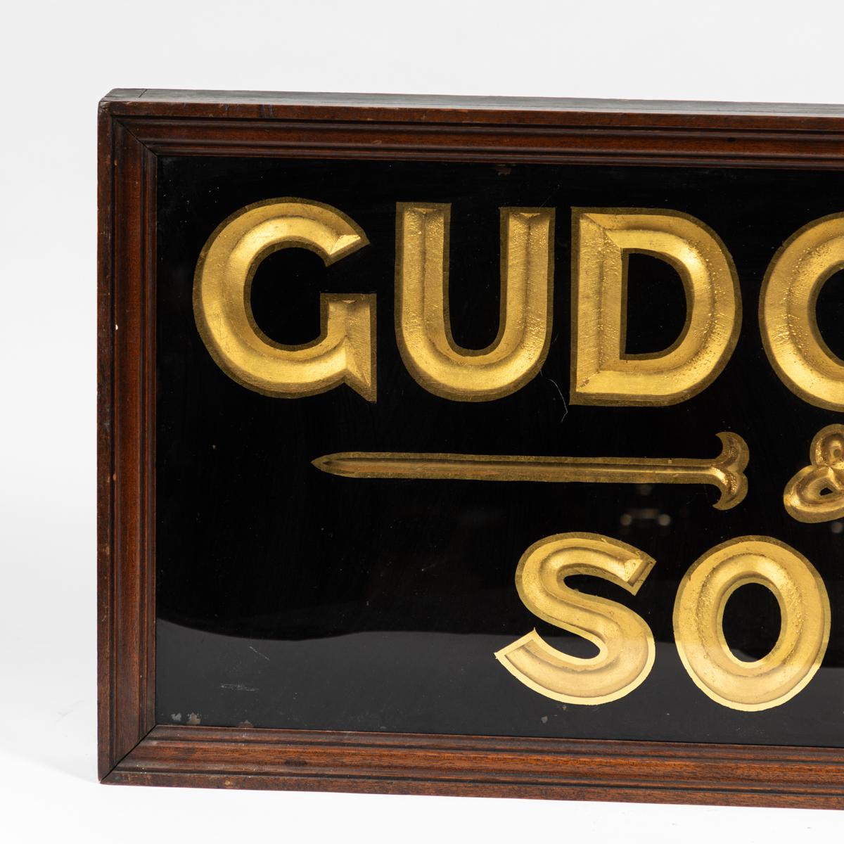 19th-century English gilded and ebonized wood sign advertising 