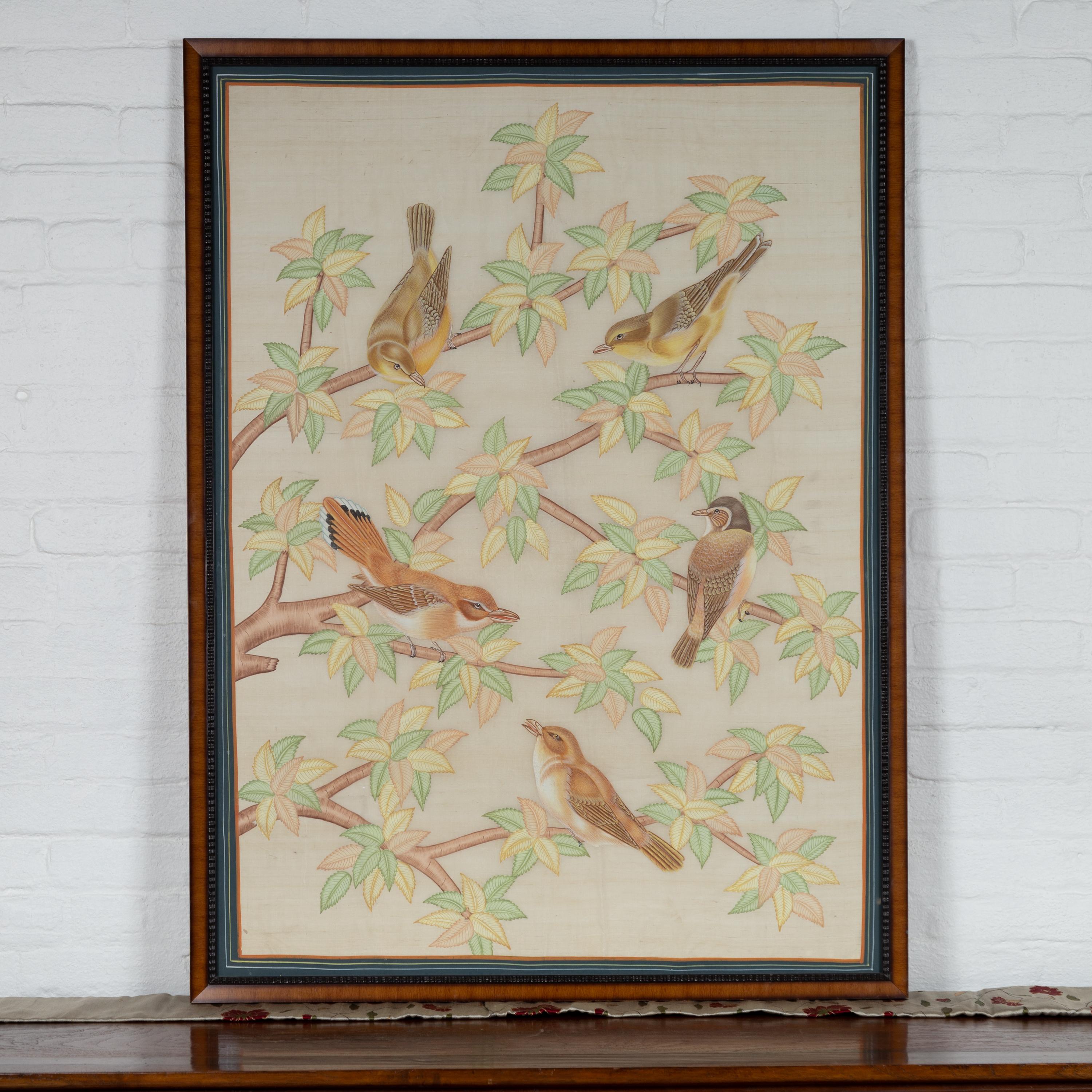 A framed Indian vintage vertical painting from the 20th century, depicting birds in trees, hand-painted on silk. Born in India during the second half of the 20th century, this charming vertical painting depicts five birds, perched on thin branches