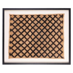 Framed West African kuba cloth mat, c. 1900's