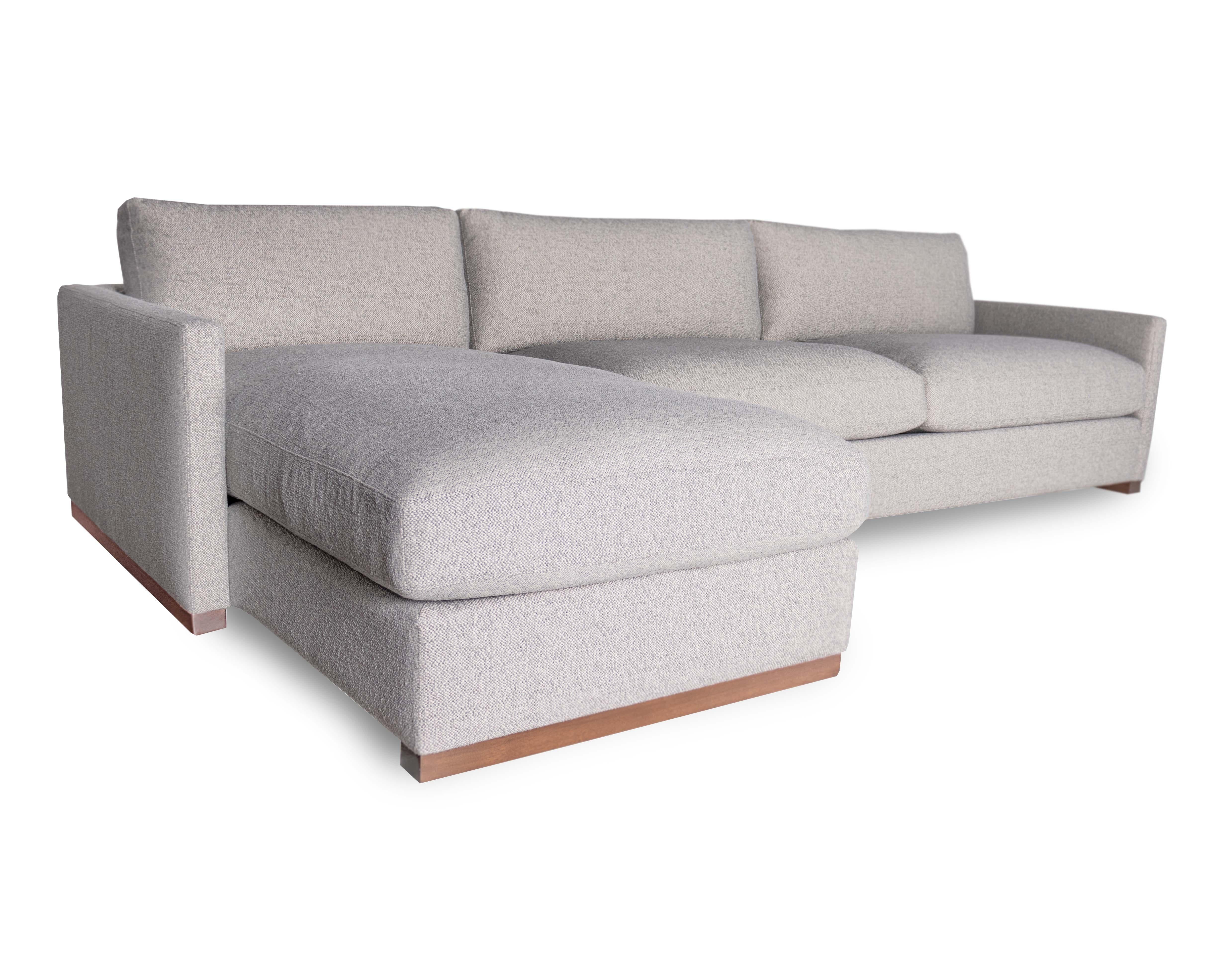 The Dublin low leg sofa and sectional take inspiration and form from southwestern architecture, with its narrow and defined track arm.  The profile is uniquely captured by the wood sled leg that runs the length of the silhouette.  The sofa has a