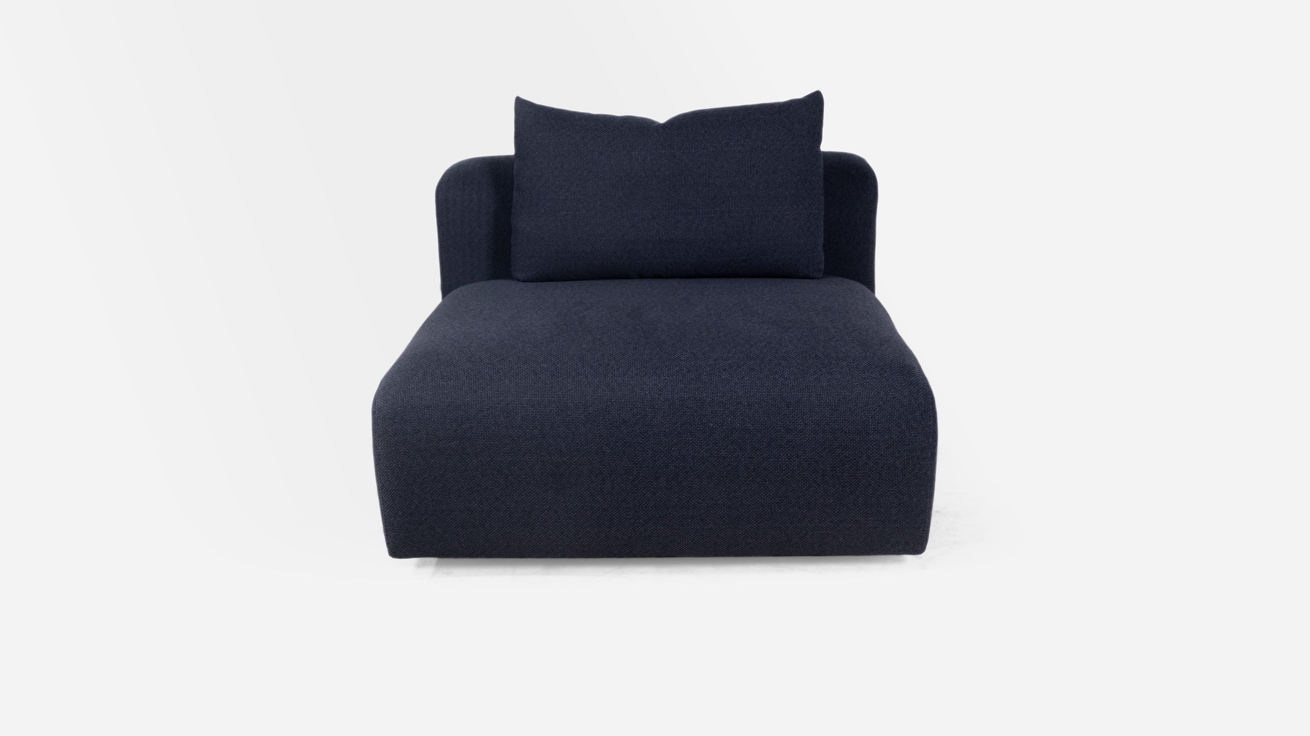 A collection of uniquely soft but sophisticated modular pieces that can be created as a sofa or a robust sofa sectional. Each piece has a loose back knife edge pillow encased in down feathers. The tightly constructed seat cushion is wrapped in