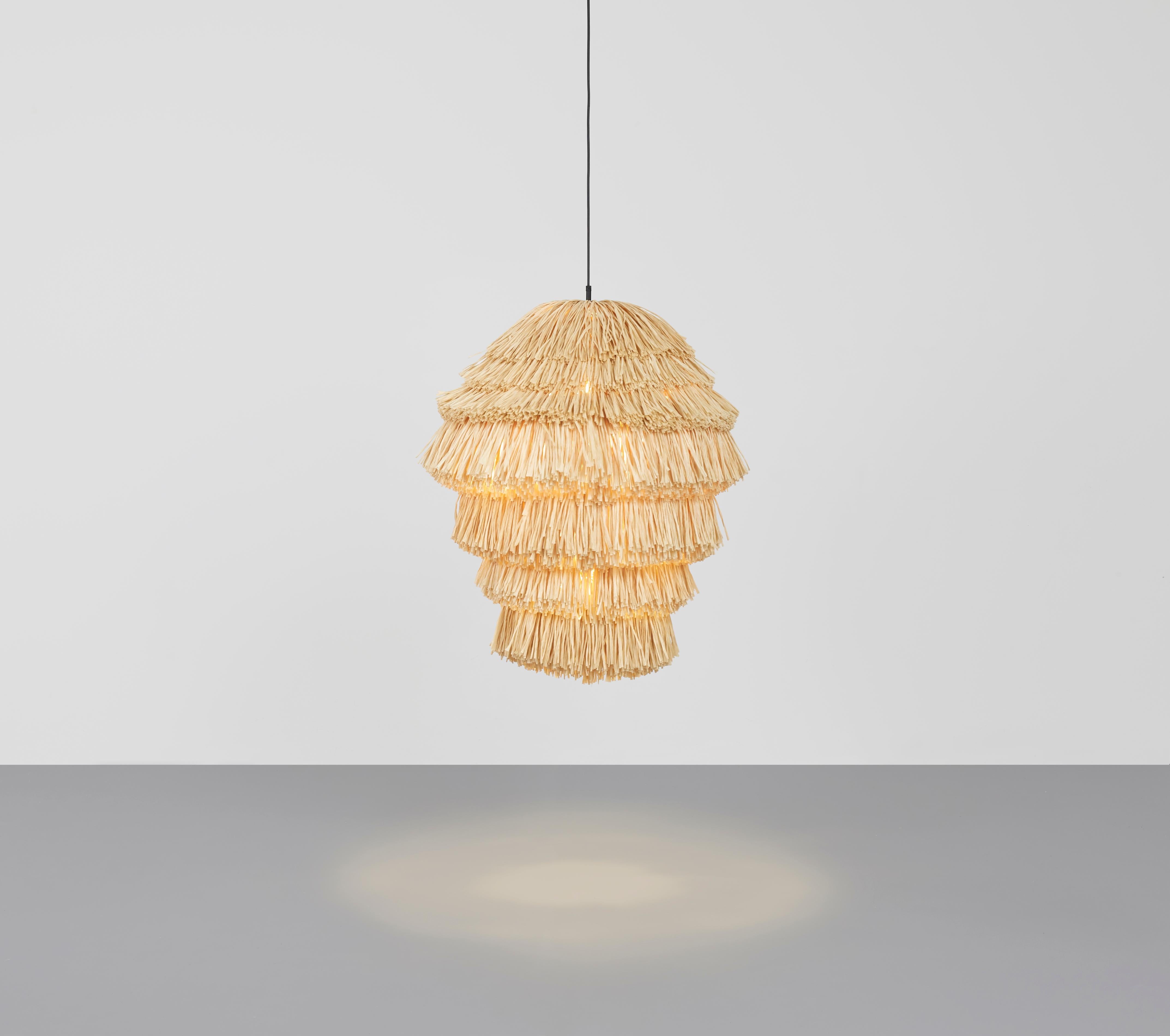 Fran as lamp by Llot Llov
Handcrafted light object
Dimensions: Ø 65 cm x H: 90 cm
Materials: raffia fringes
Colour: beige
Also available in green, red, black. 

With their bulky silhouette and rustling fringes, the FRAN lights are reminiscent