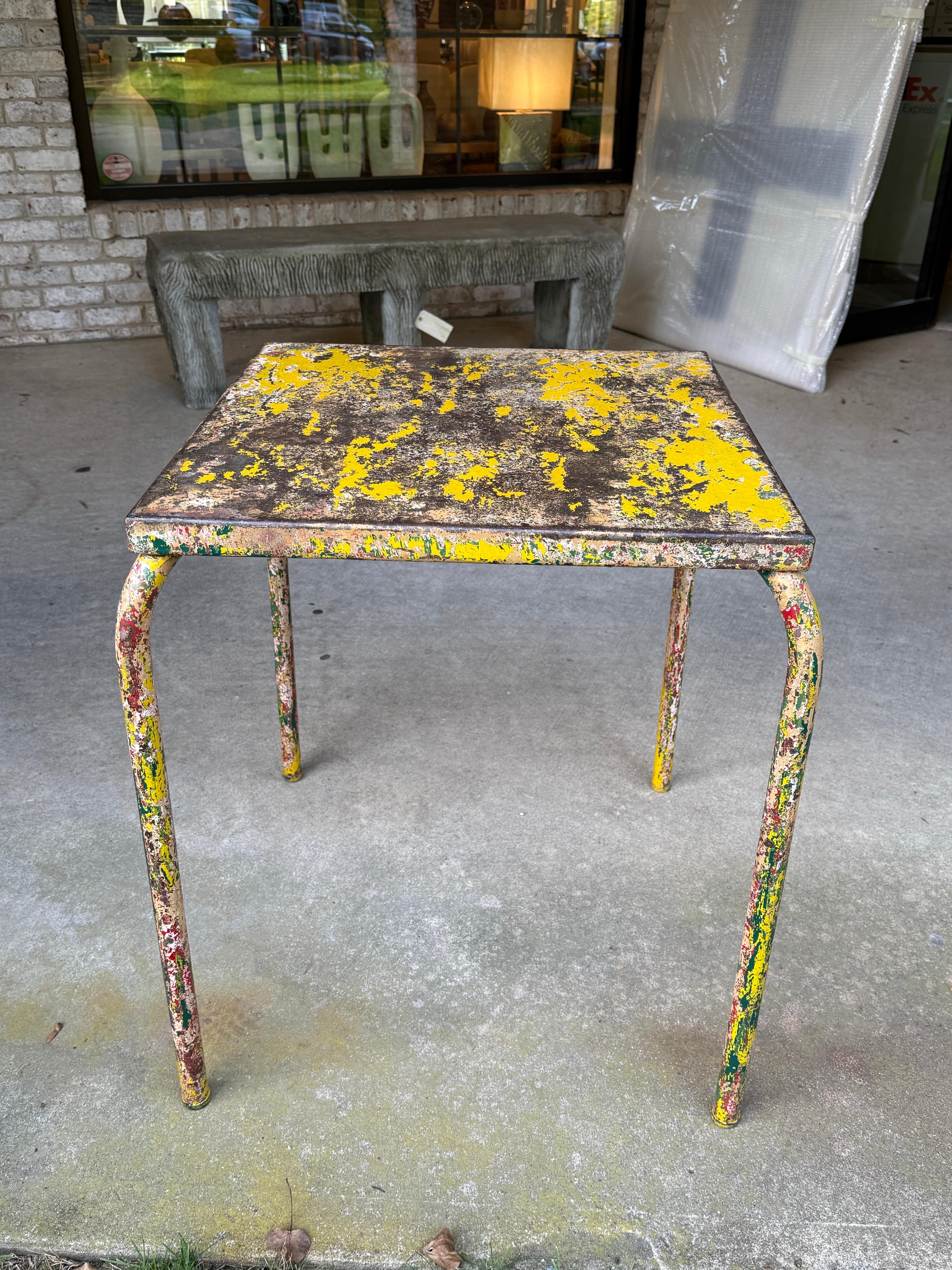 Side table in metal tube entirely covered in a colorful mix of paint and patina acquired over years of use and enjoyment, center hole is original, Truly an art piece by Xavier Pauchard.  There is a second similar table available - check our listings