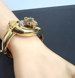 Francia años 90 Pulsera de oro amarillo, diamantes, esmeralda y diálogo de panteras