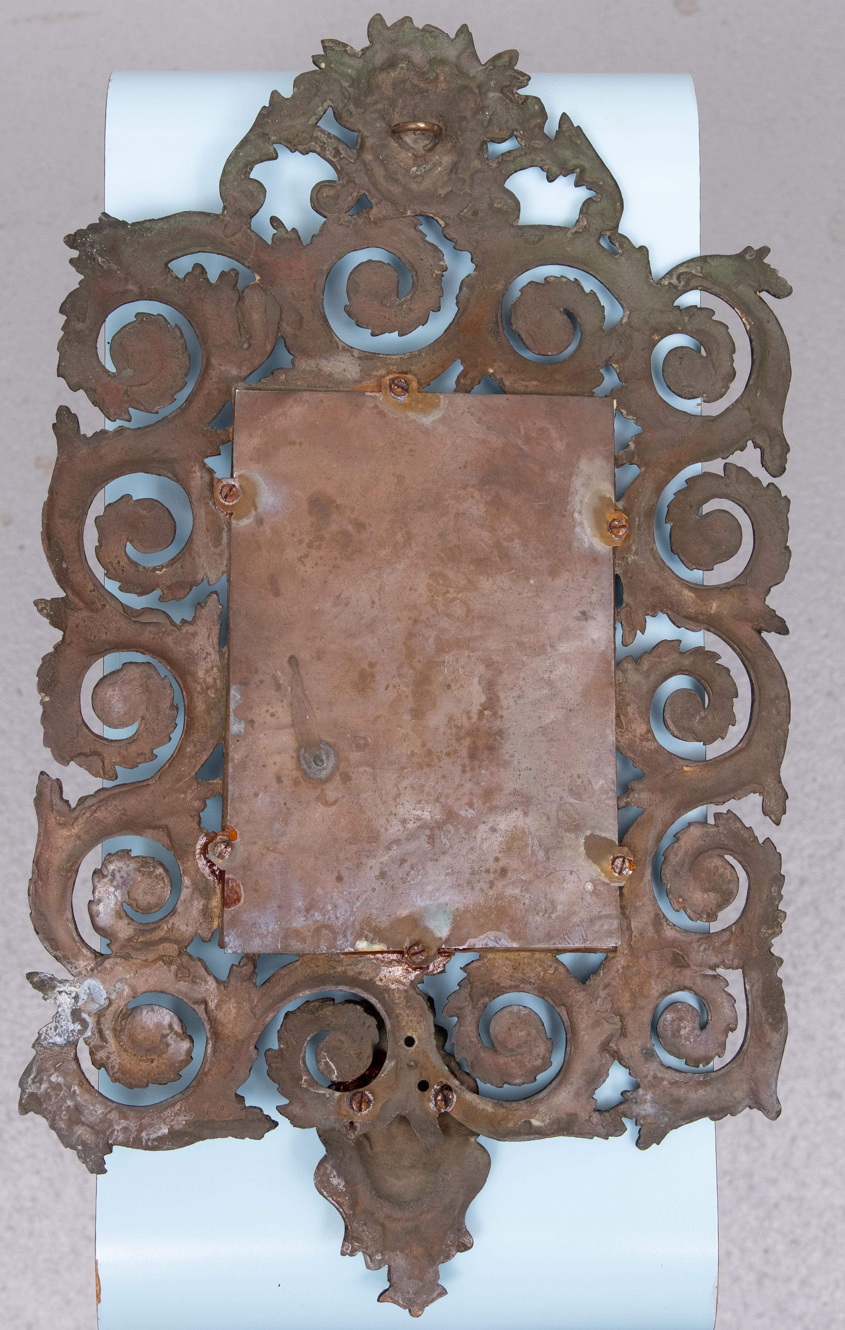 Miroir mural ancien en bronze moulé à tête de femme Bon état - En vente à Den Haag, NL