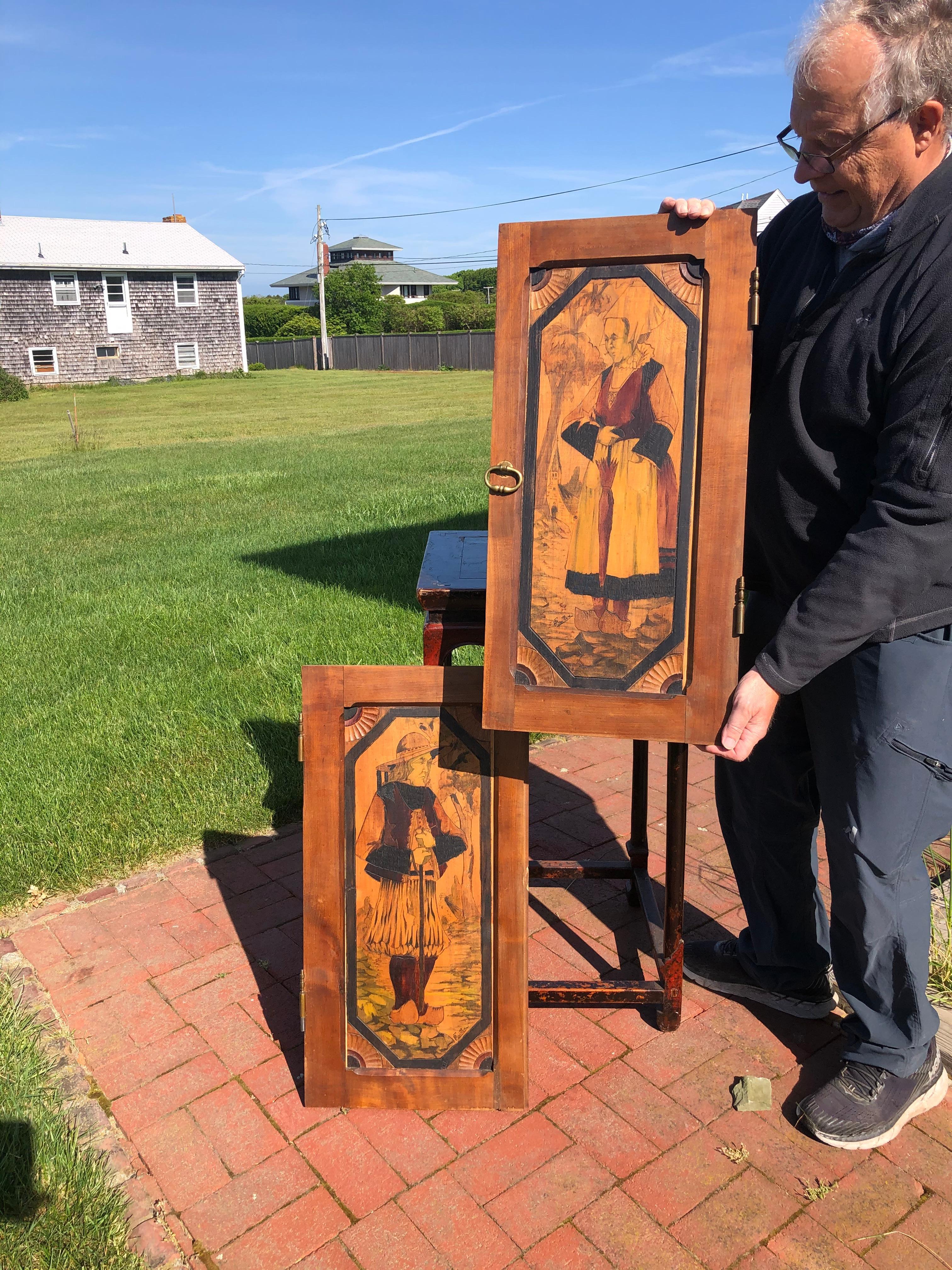 From an old New England collection of fine Arts & Crafts furnishings.

Two large all original unique works of art, circa 1920

This is a beautiful set of two (2) hand incised and signed wooden cabinet panels - all hand incised and hand painted
