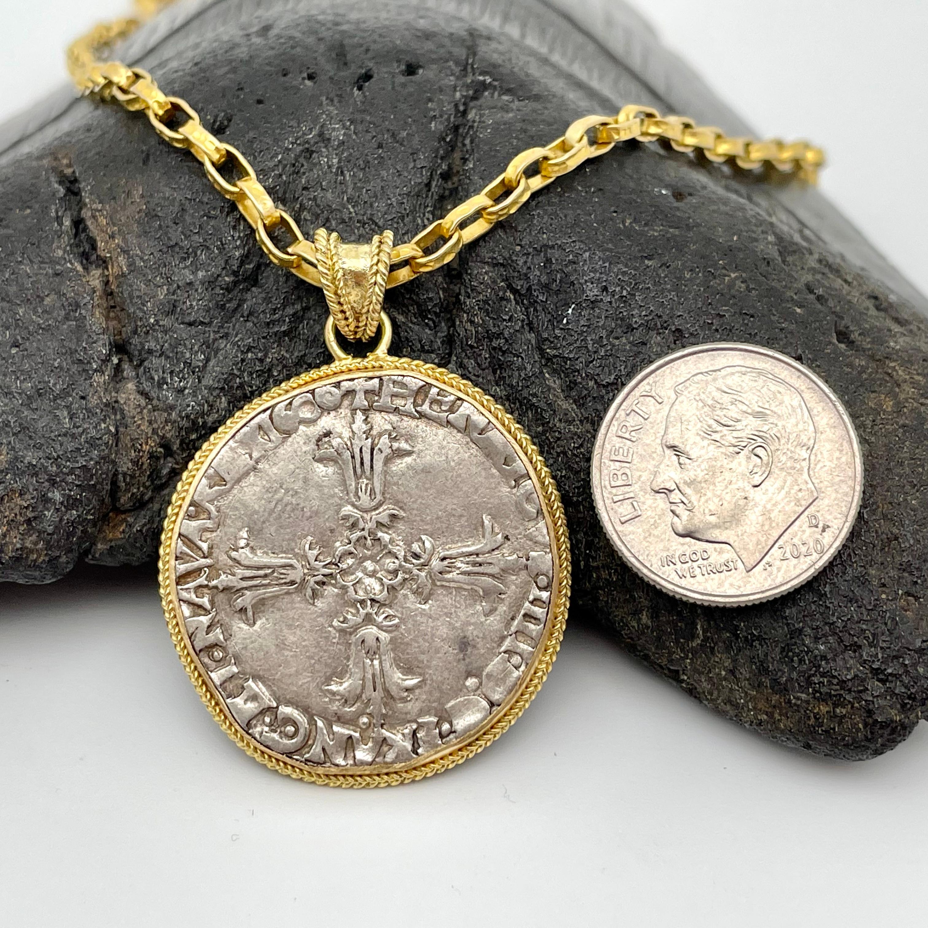 This hand struck French coin introduced by Henry III in 1577 was the primary silver coin of France until milled coins were introduced 1n 1646.  It featured a cross (Croix feuillue) with date on one side, and royal coat of arms with fleur-de-lis on
