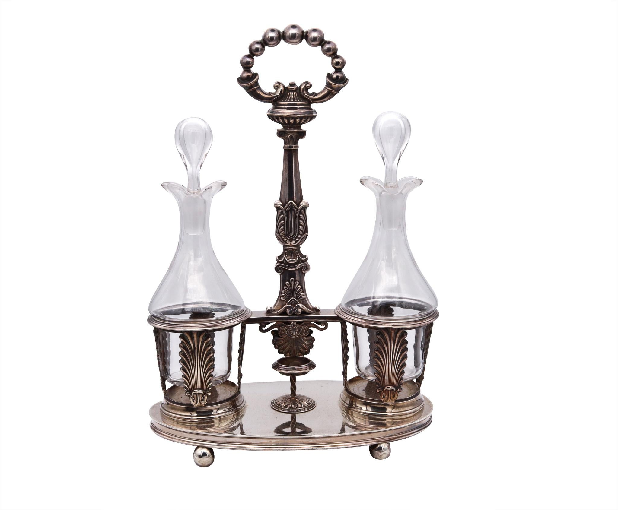 Beautiful Cruet set designed by Armand Caillat (1822-1901).

Very nice French neo-classical piece from the period of the king Louis Phillipe (1830-1848). This handsome and elegant Hoilier Cruet was crafted in the city of Lyon by silversmith Armand